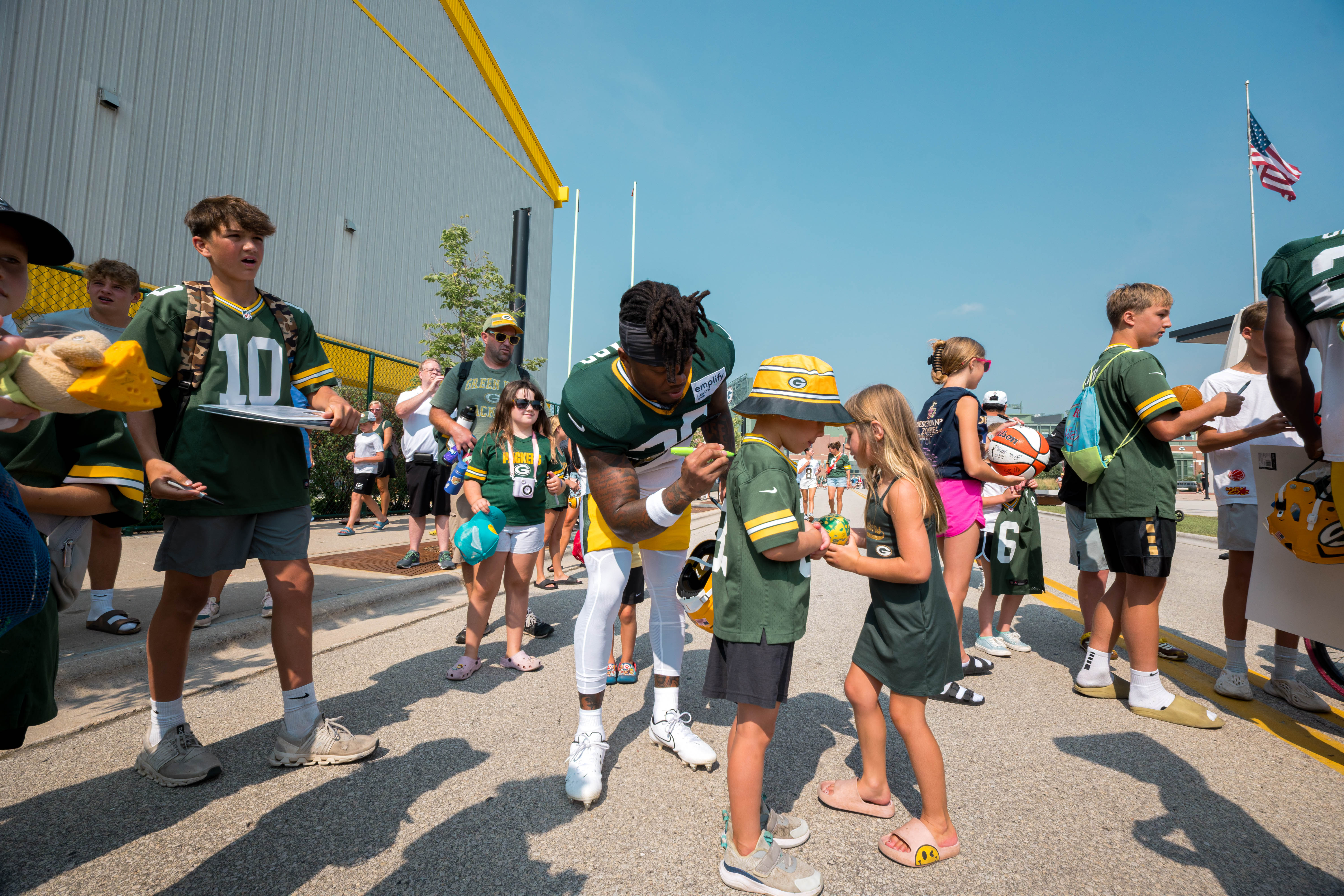 Green Bay Packers players sign autographs for young fans during training camp in Green Bay, Wisconsin, on August 6th, 2025. Photography by Ross Harried for Second Crop Sports.