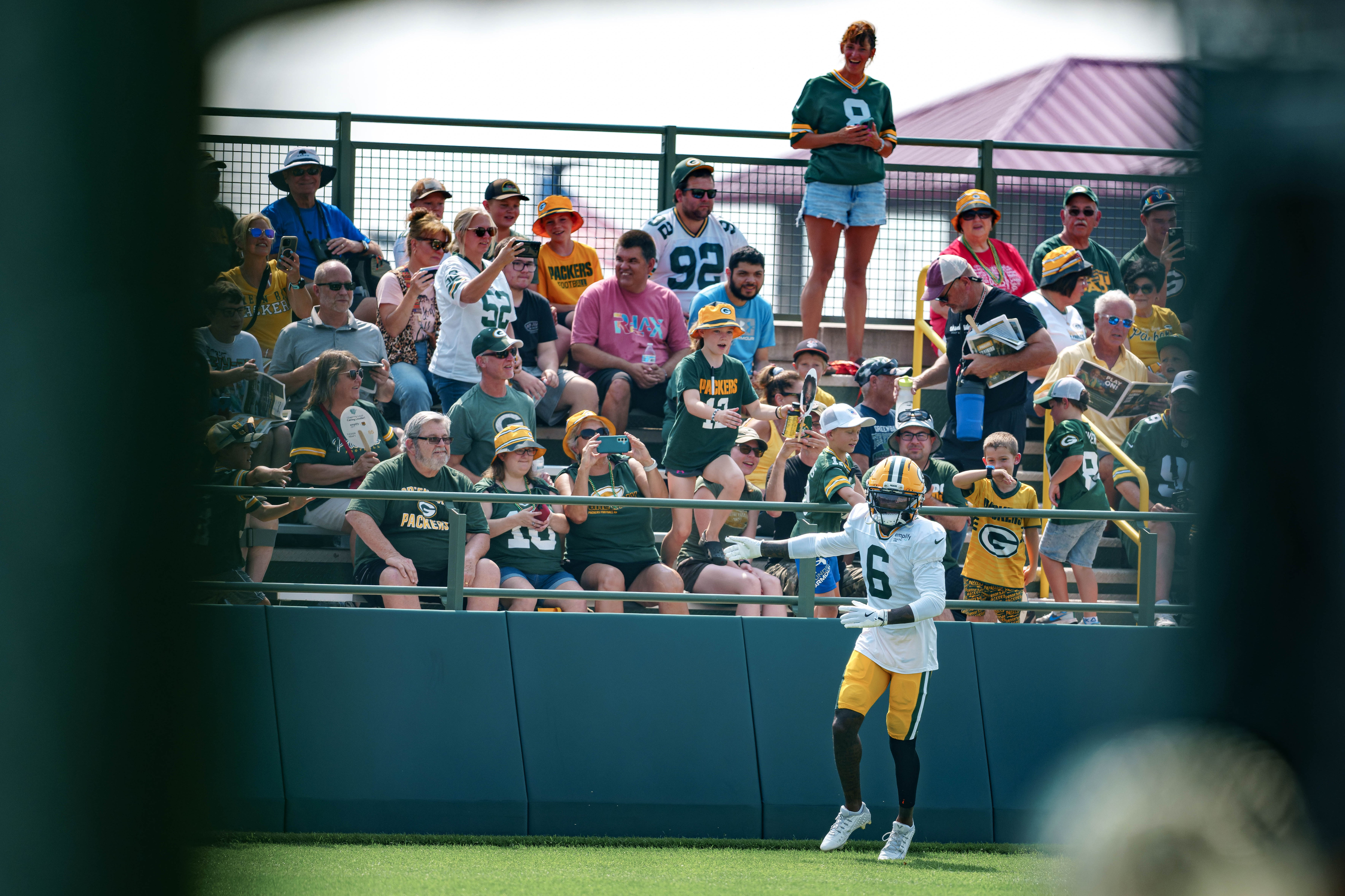 Green Bay Packers wide receiver Mecole Hardman (6) interacts with fans during NFL training camp at Ray Nitschke Field in Green Bay, Wisconsin, on August 6th, 2025. Photography by Ross Harried for Second Crop Sports.