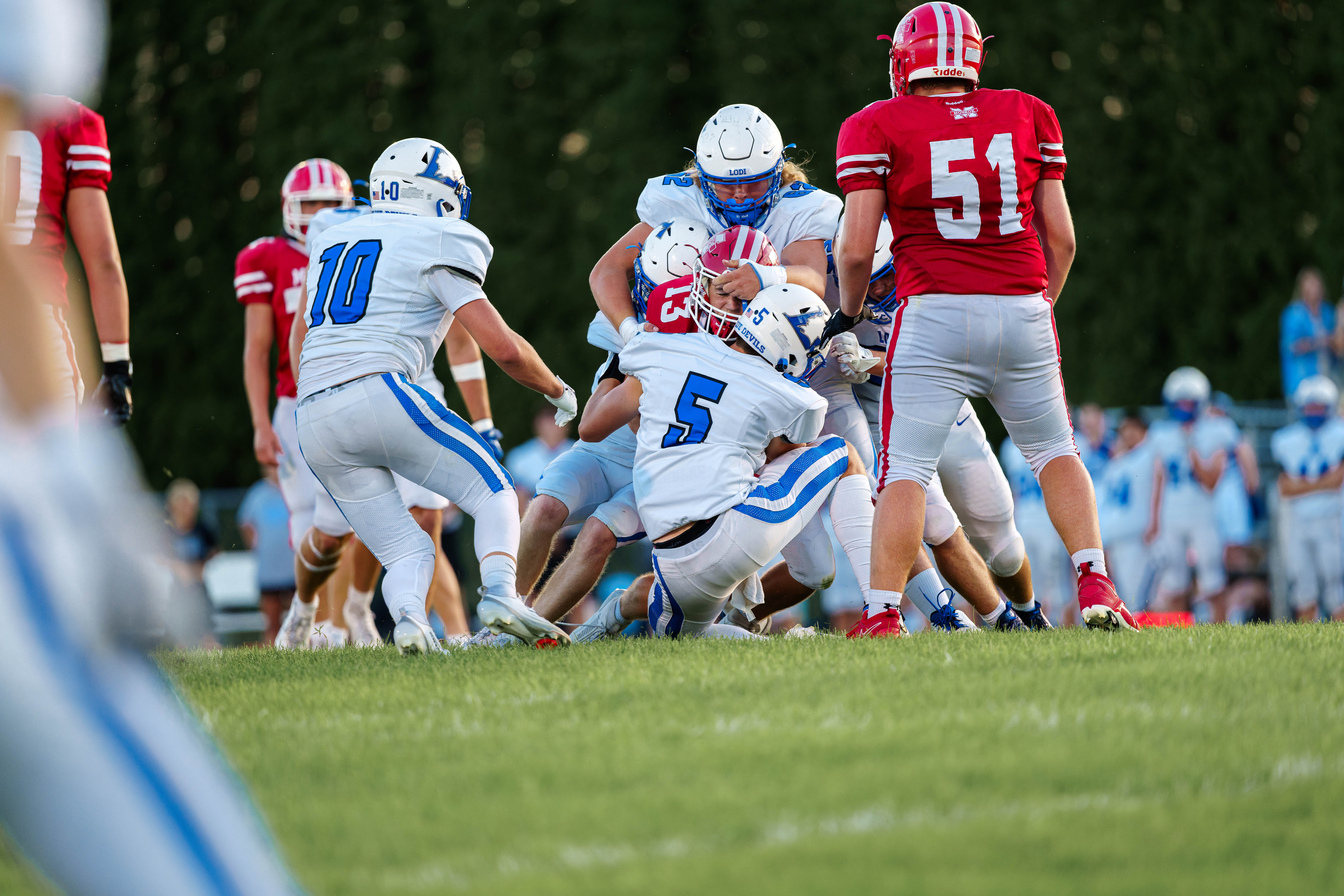 The Monroe Cheesemakers host the Lodi Blue Devils in a high school football game at Monroe High School in Monroe, Wisconsin, on August 22, 2025. Lodi defeated Monroe 21–14. Photography by Ross Harried for Second Crop Sports.