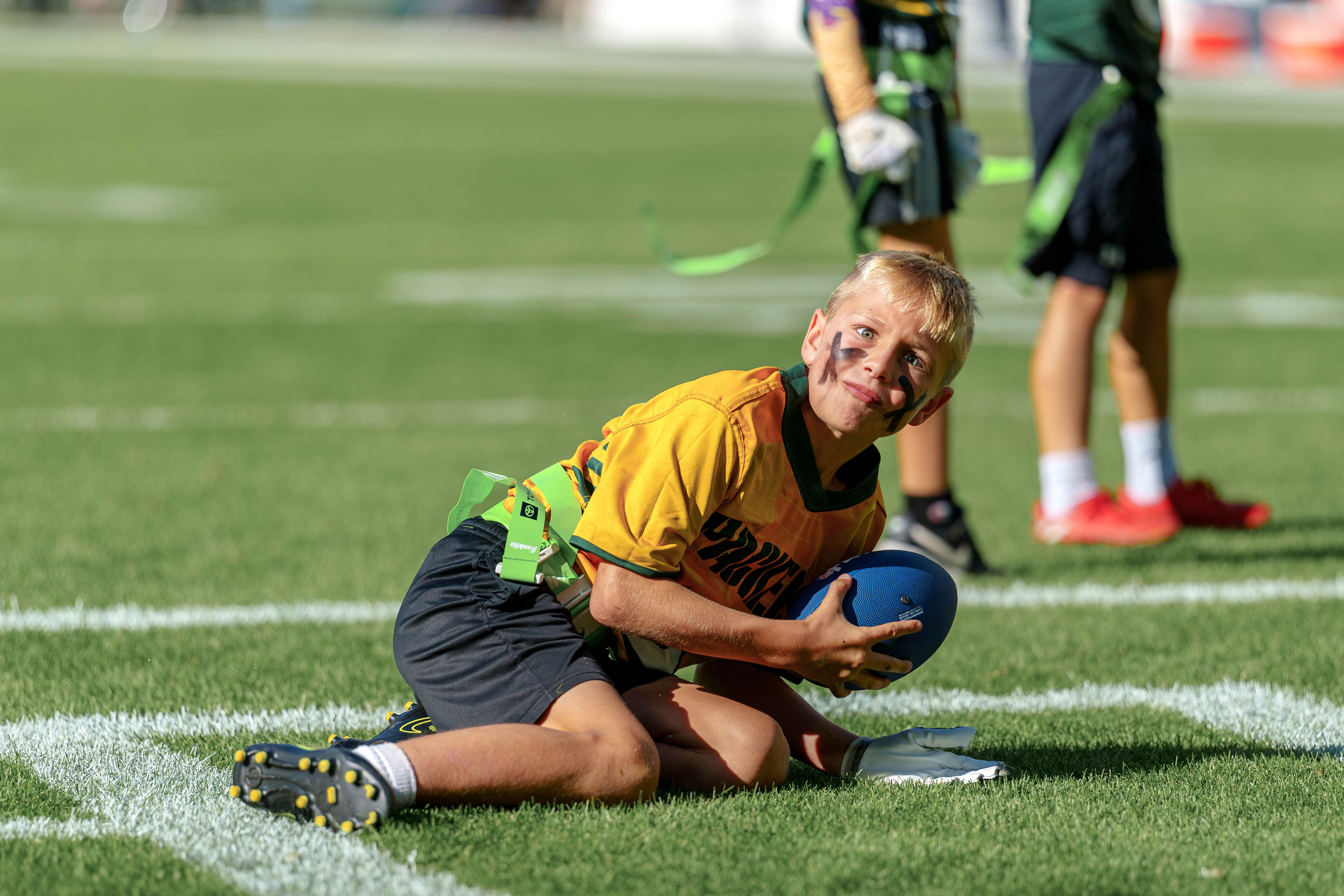 The Verona Area flag football team takes the field during halftime of an NFL preseason game between the Green Bay Packers and Seattle Seahawks at Lambeau Field in Green Bay, Wisconsin, on August 23, 2025. Photography by Ross Harried for Second Crop Sports.