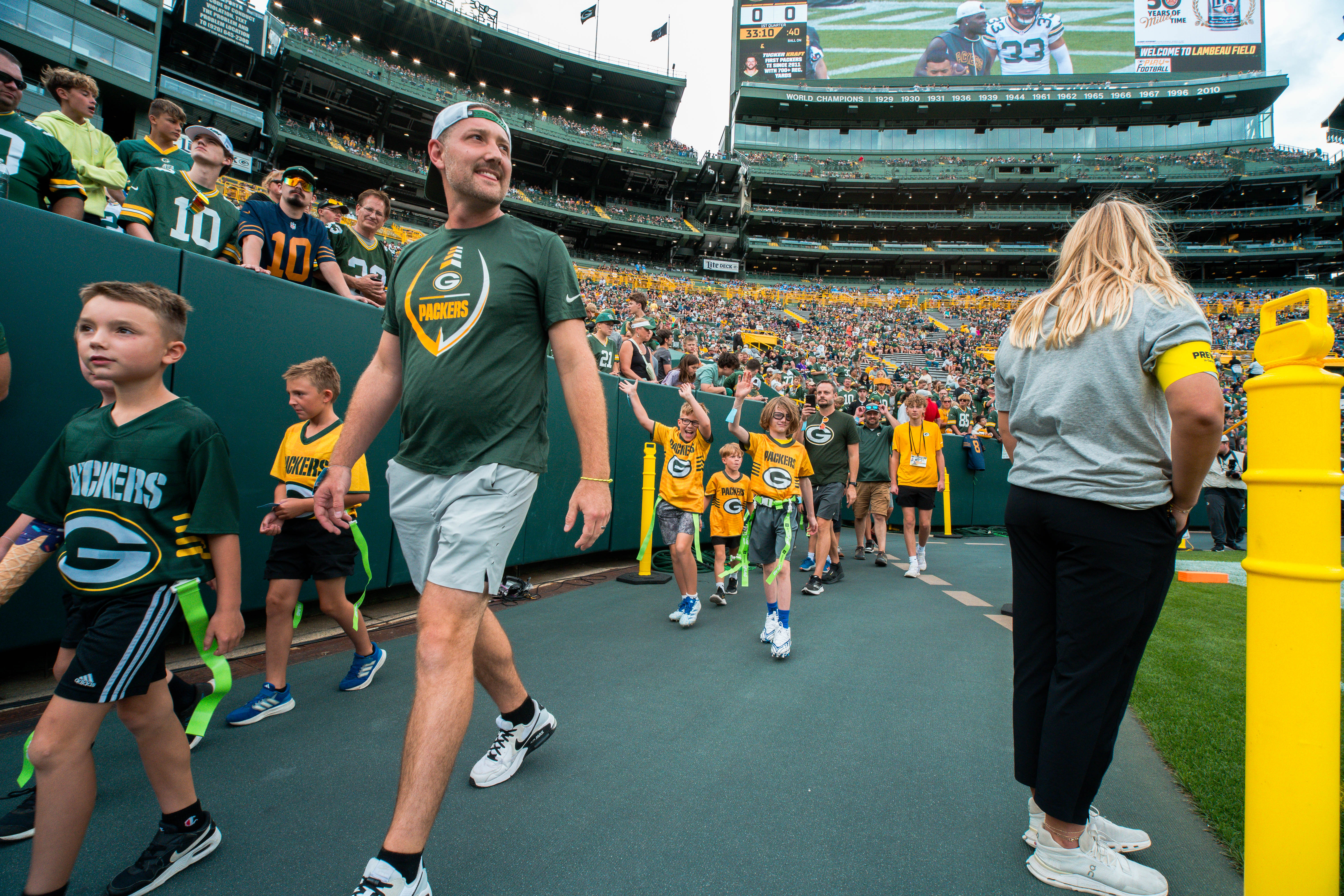 The Verona Area flag football team visits Lambeau Field in Green Bay, Wisconsin, ahead of their halftime game during the NFL preseason matchup between the Green Bay Packers and Seattle Seahawks on August 23, 2025. Photography by Ross Harried for Second Crop Sports.