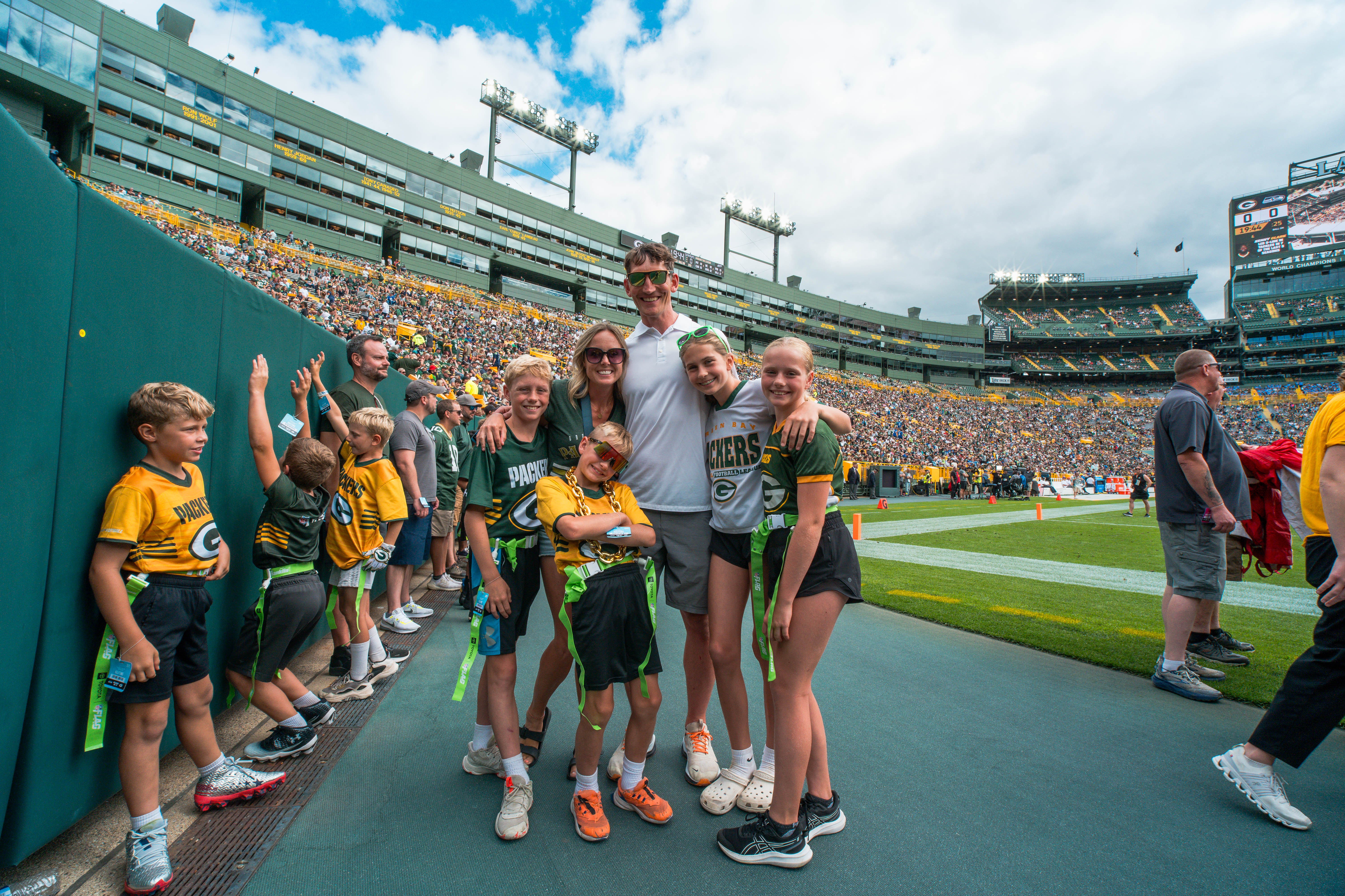 The Verona Area flag football team visits Lambeau Field in Green Bay, Wisconsin, ahead of their halftime game during the NFL preseason matchup between the Green Bay Packers and Seattle Seahawks on August 23, 2025. Photography by Ross Harried for Second Crop Sports.