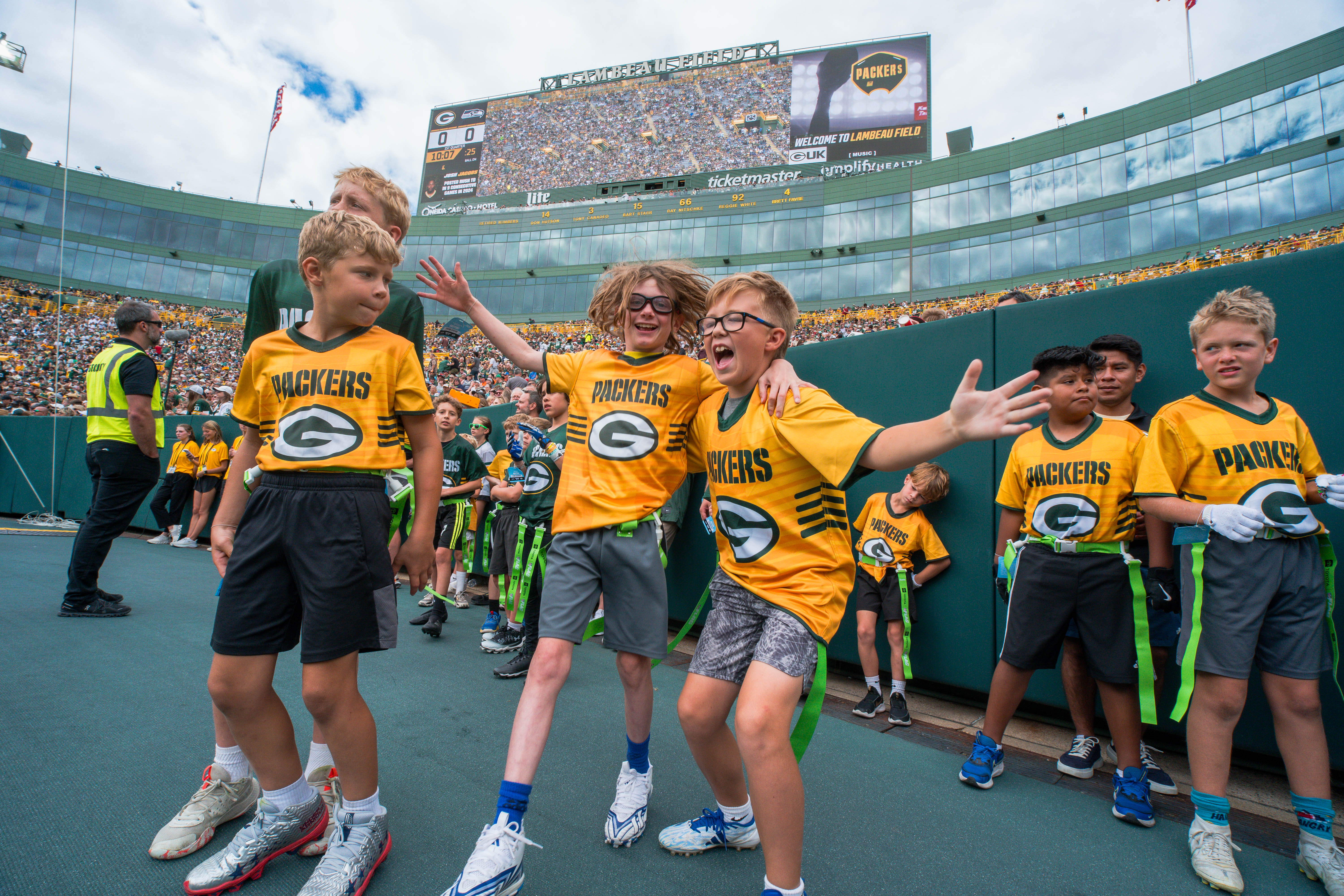 The Verona Area flag football team visits Lambeau Field in Green Bay, Wisconsin, ahead of their halftime game during the NFL preseason matchup between the Green Bay Packers and Seattle Seahawks on August 23, 2025. Photography by Ross Harried for Second Crop Sports.