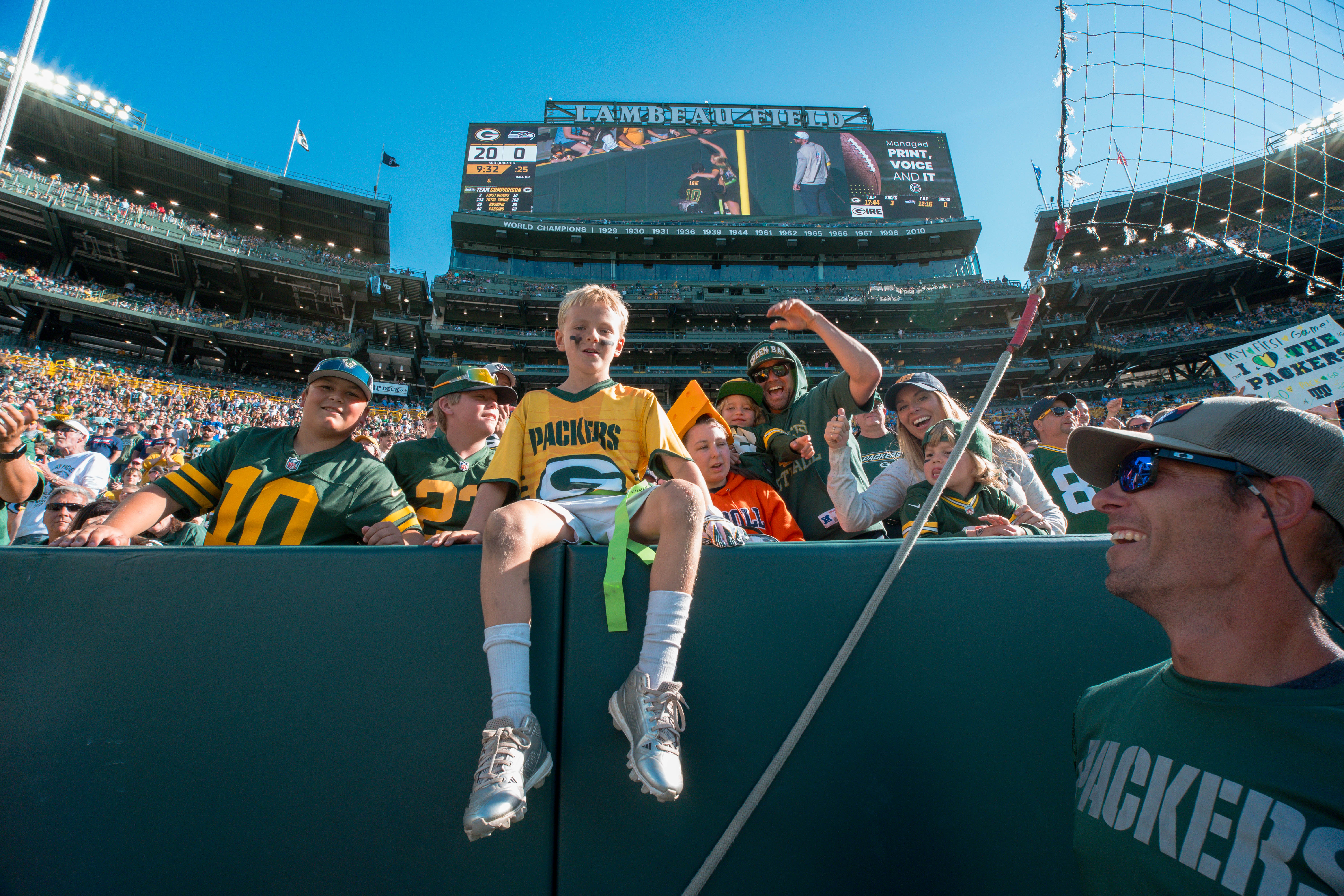 The Verona Area flag football team takes the field during halftime of an NFL preseason game between the Green Bay Packers and Seattle Seahawks at Lambeau Field in Green Bay, Wisconsin, on August 23, 2025. Photography by Ross Harried for Second Crop Sports.