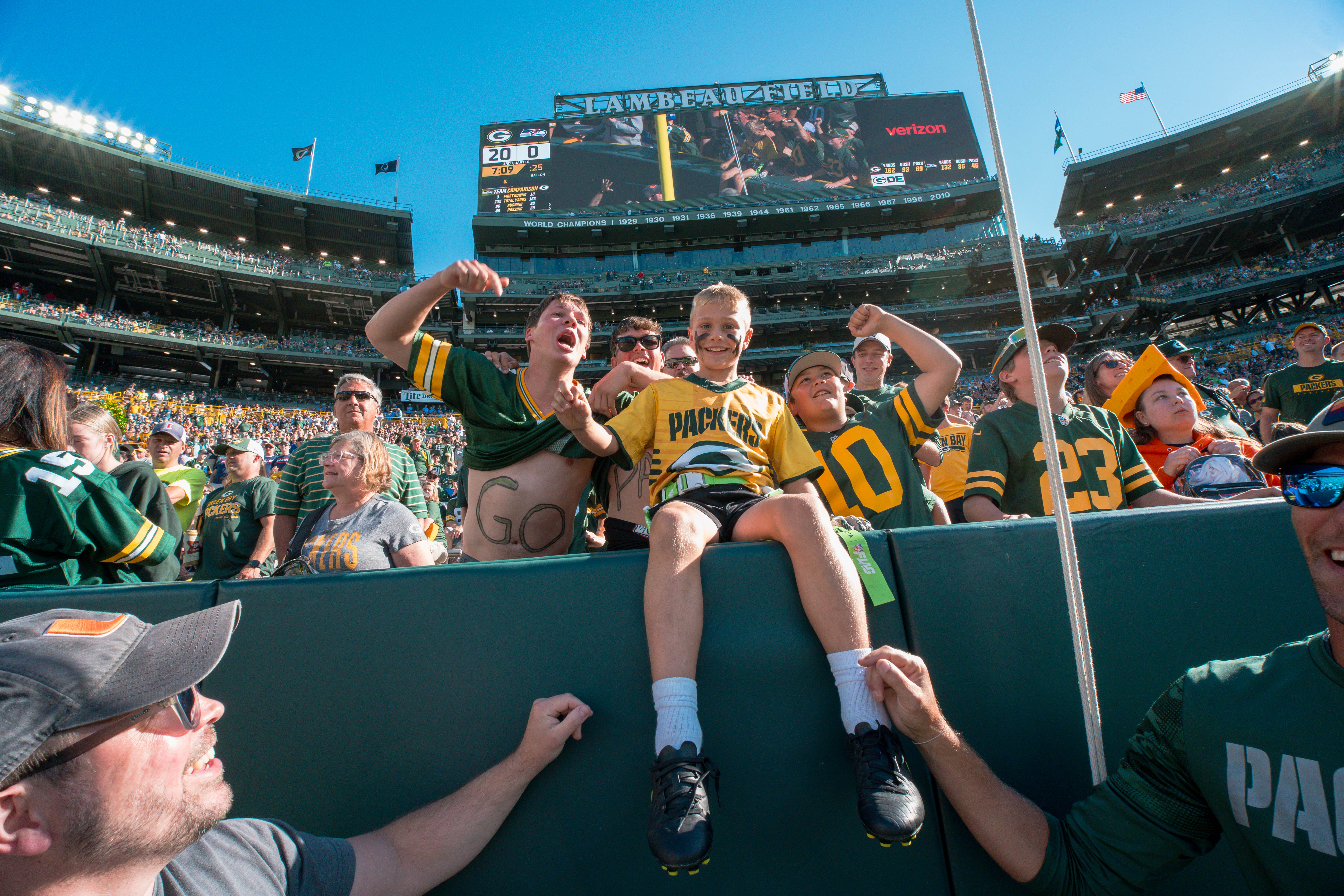The Verona Area flag football team takes the field during halftime of an NFL preseason game between the Green Bay Packers and Seattle Seahawks at Lambeau Field in Green Bay, Wisconsin, on August 23, 2025. Photography by Ross Harried for Second Crop Sports.