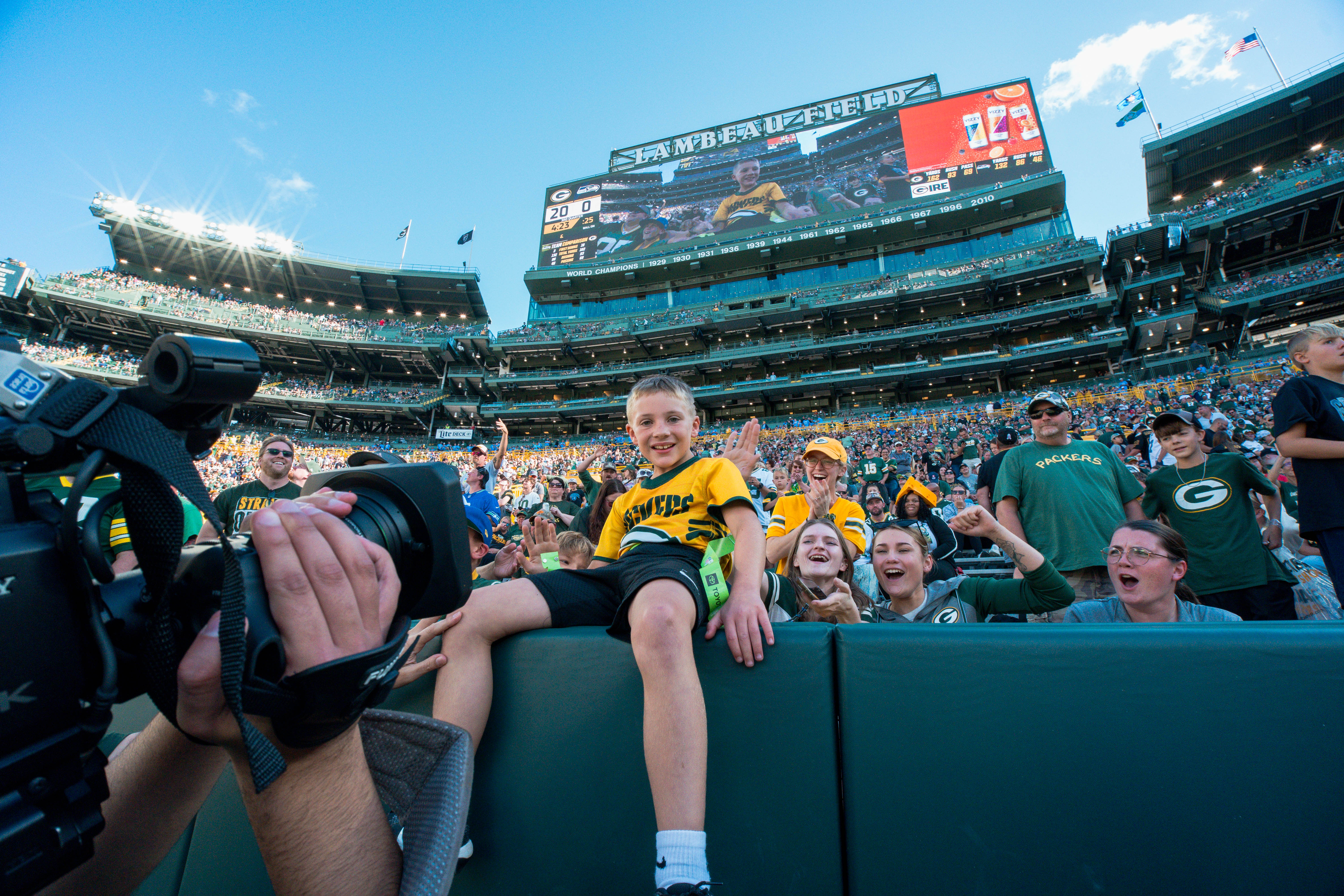 The Verona Area flag football team takes the field during halftime of an NFL preseason game between the Green Bay Packers and Seattle Seahawks at Lambeau Field in Green Bay, Wisconsin, on August 23, 2025. Photography by Ross Harried for Second Crop Sports.