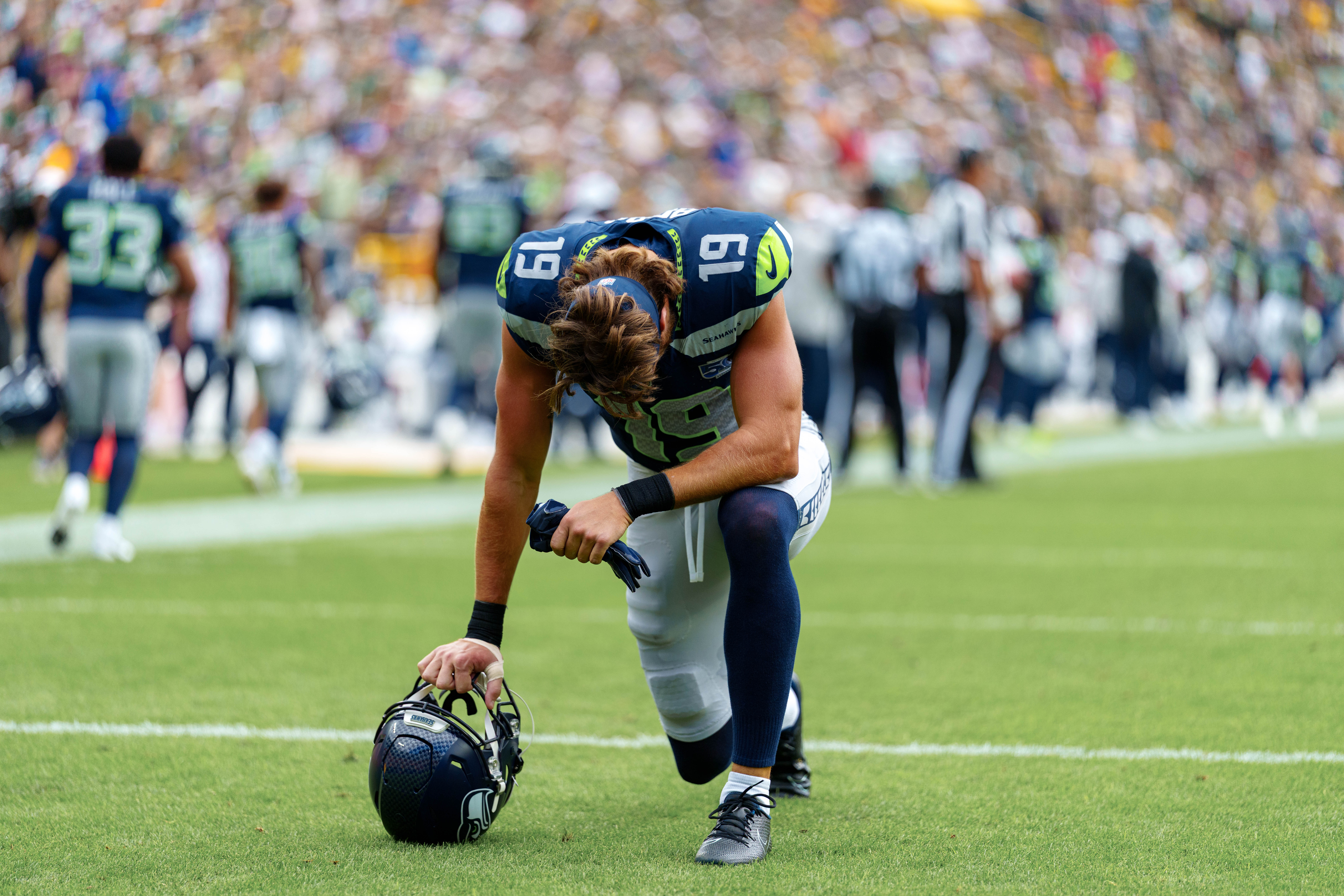 Seattle Seahawks wide receiver Jake Bobo (19) takes a knee in the end zone before taking on the Green Bay Packers at Lambeau Field on August 23, 2025 in Green Bay, Wisconsin. Bobo would exit the game before halftime with an injury. Photography by Ross Harried for Second Crop Sports.