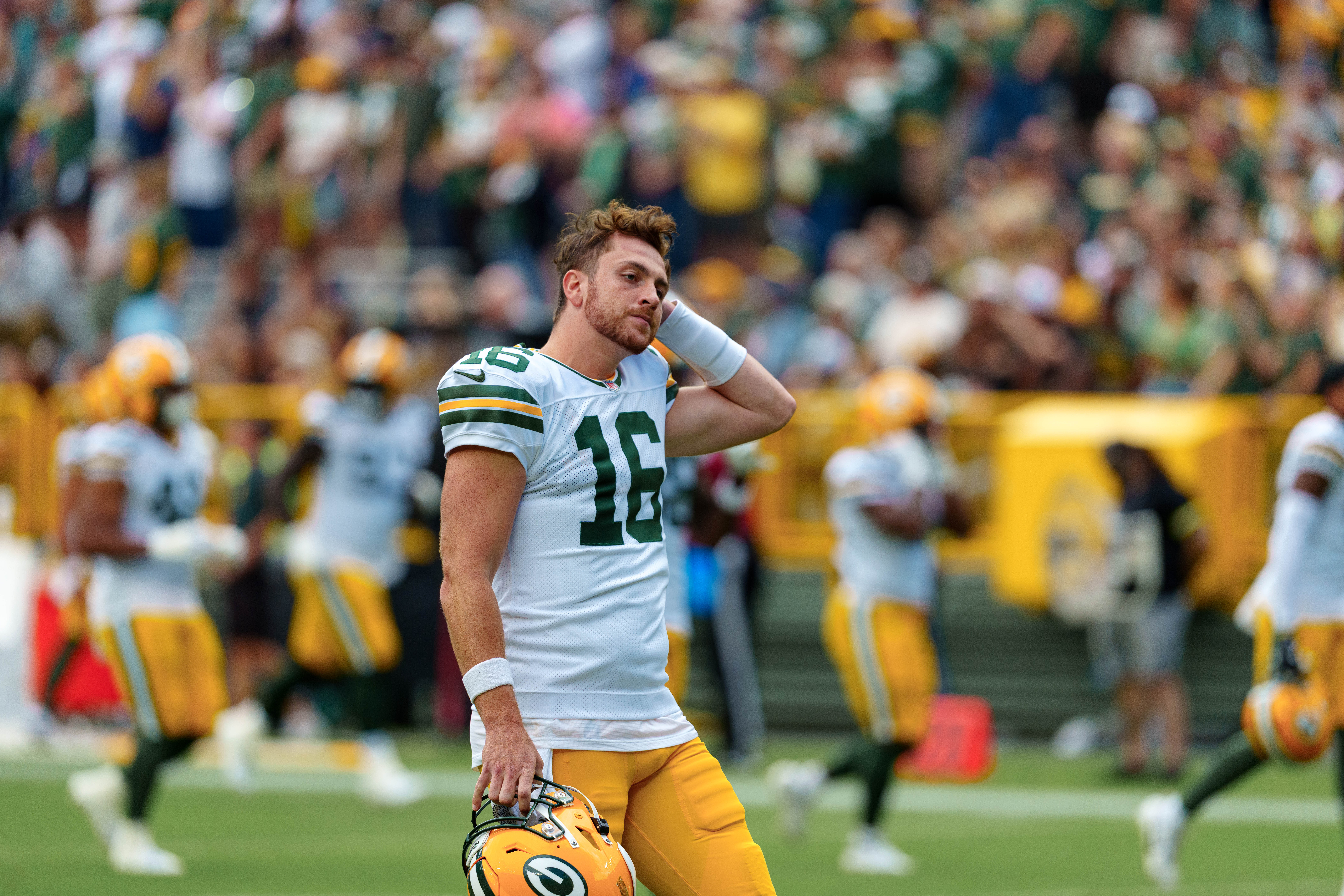 Green Bay Packers quarterback Sean Clifford (16) heads to the sidelines before taking on the Seattle Seahawks at Lambeau Field on August 23, 2025 in Green Bay, Wisconsin. Photography by Ross Harried for Second Crop Sports.