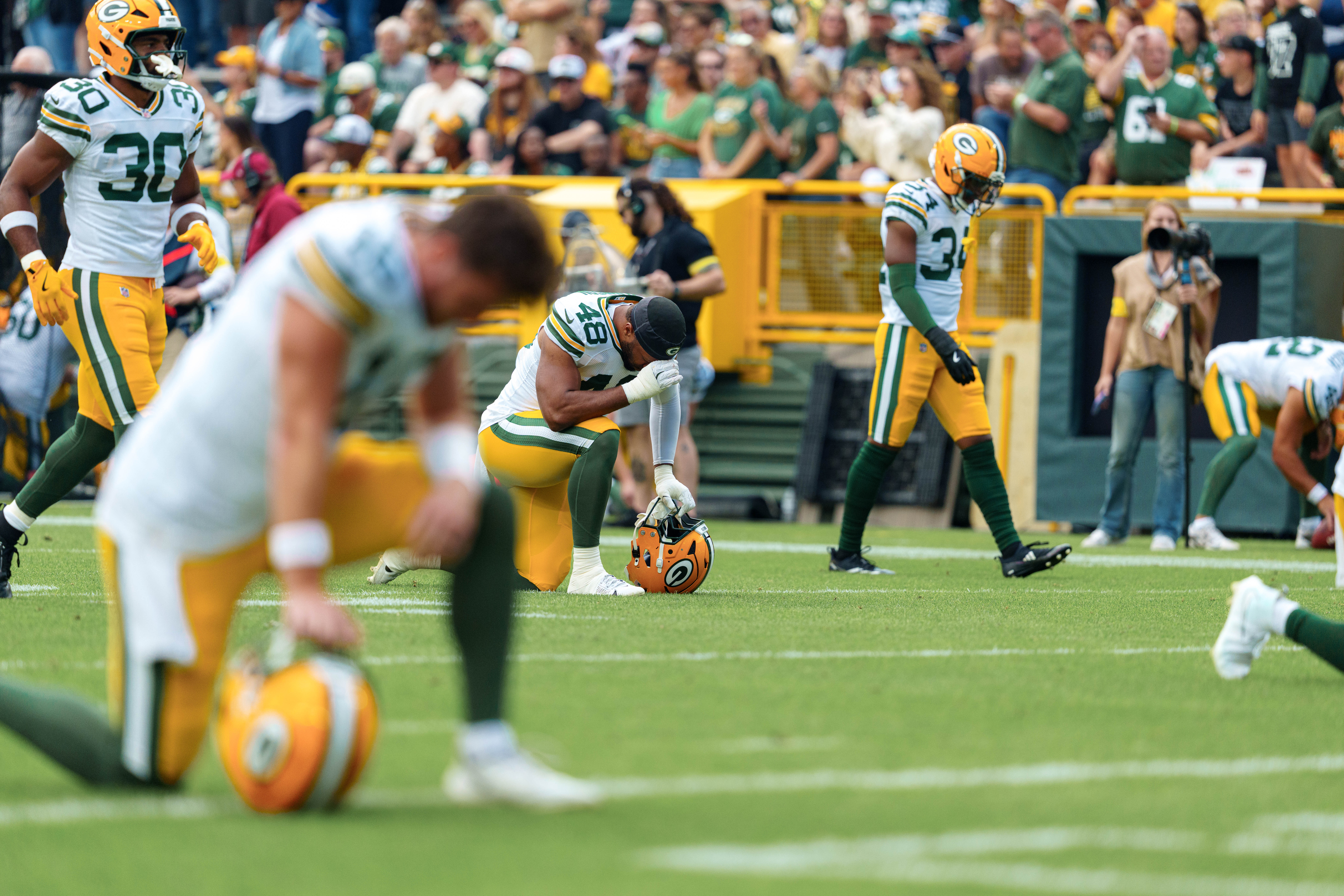 Green Bay Packers safety Omar Brown (40) and several other Packers take a knee before taking on the Seattle Seahawks at Lambeau Field on August 23, 2025 in Green Bay, Wisconsin. Photography by Ross Harried for Second Crop Sports.