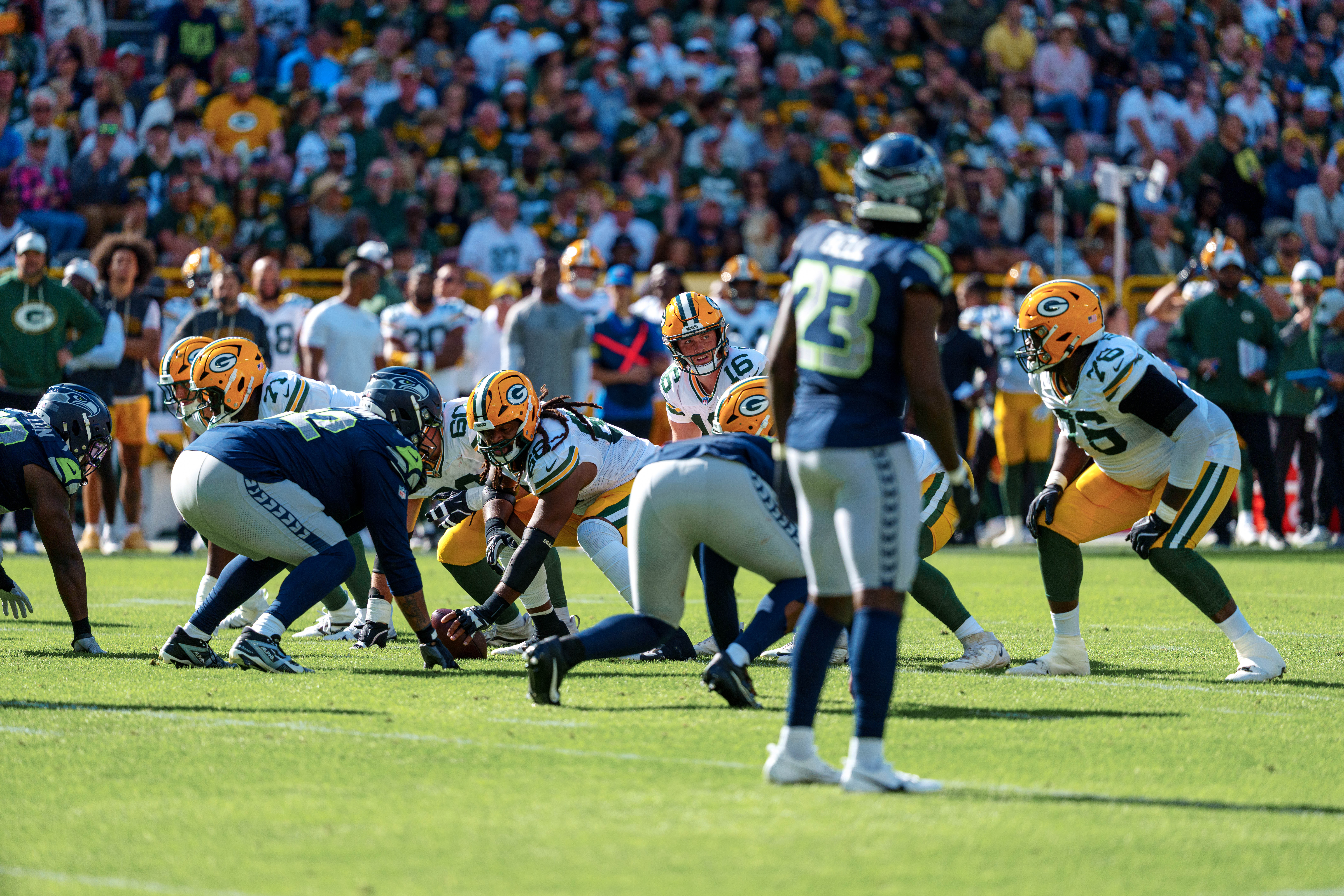 Green Bay Packers quarterback Sean Clifford (16) looks down the line of scrimmage before snapping the ball against the Seattle Seahawks at Lambeau Field on August 23, 2025 in Green Bay, Wisconsin. Photography by Ross Harried for Second Crop Sports.