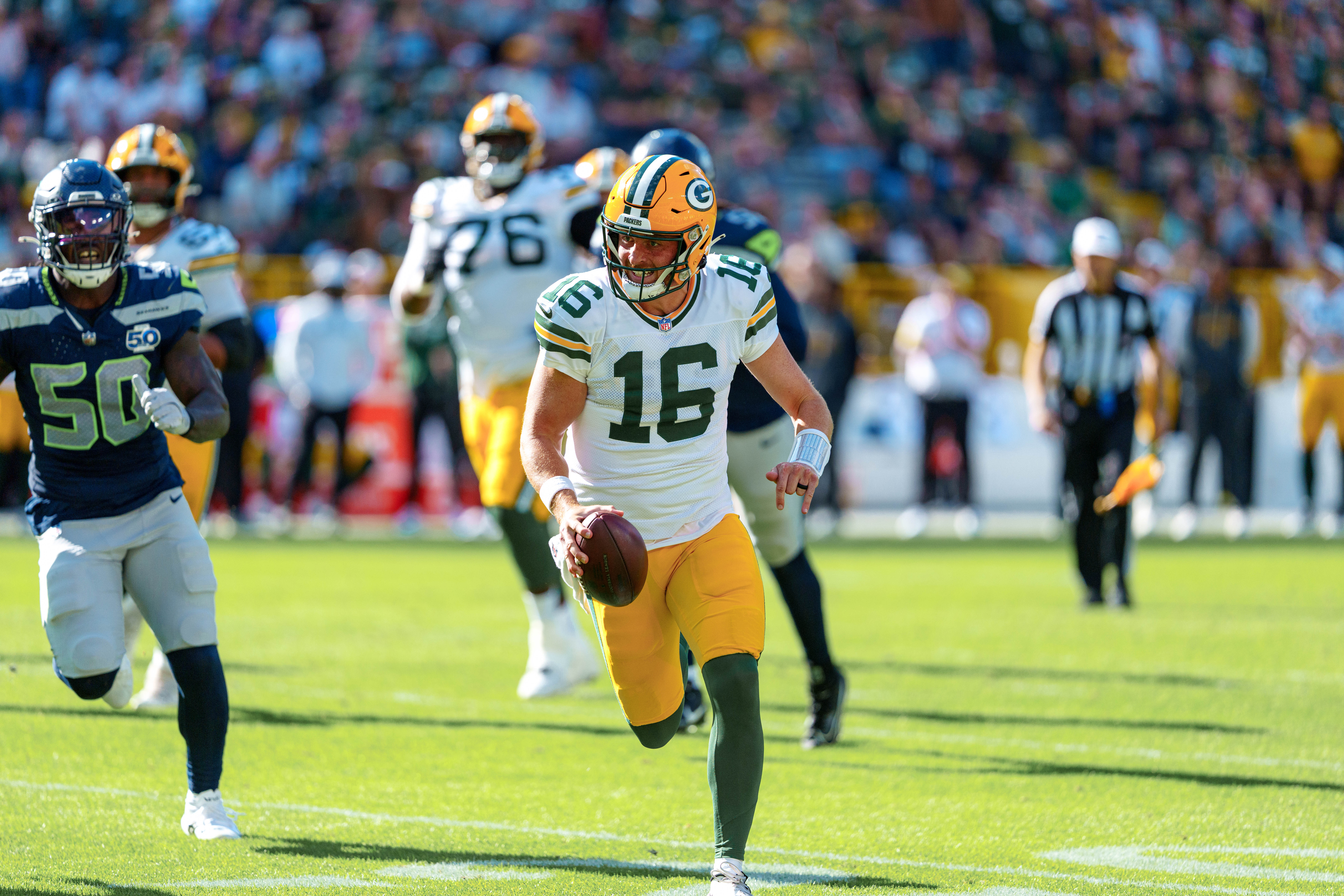 Green Bay Packers quarterback Sean Clifford (16) runs for the sideline against theSeattle Seahawks at Lambeau Field on August 23, 2025 in Green Bay, Wisconsin. Photography by Ross Harried for Second Crop Sports.