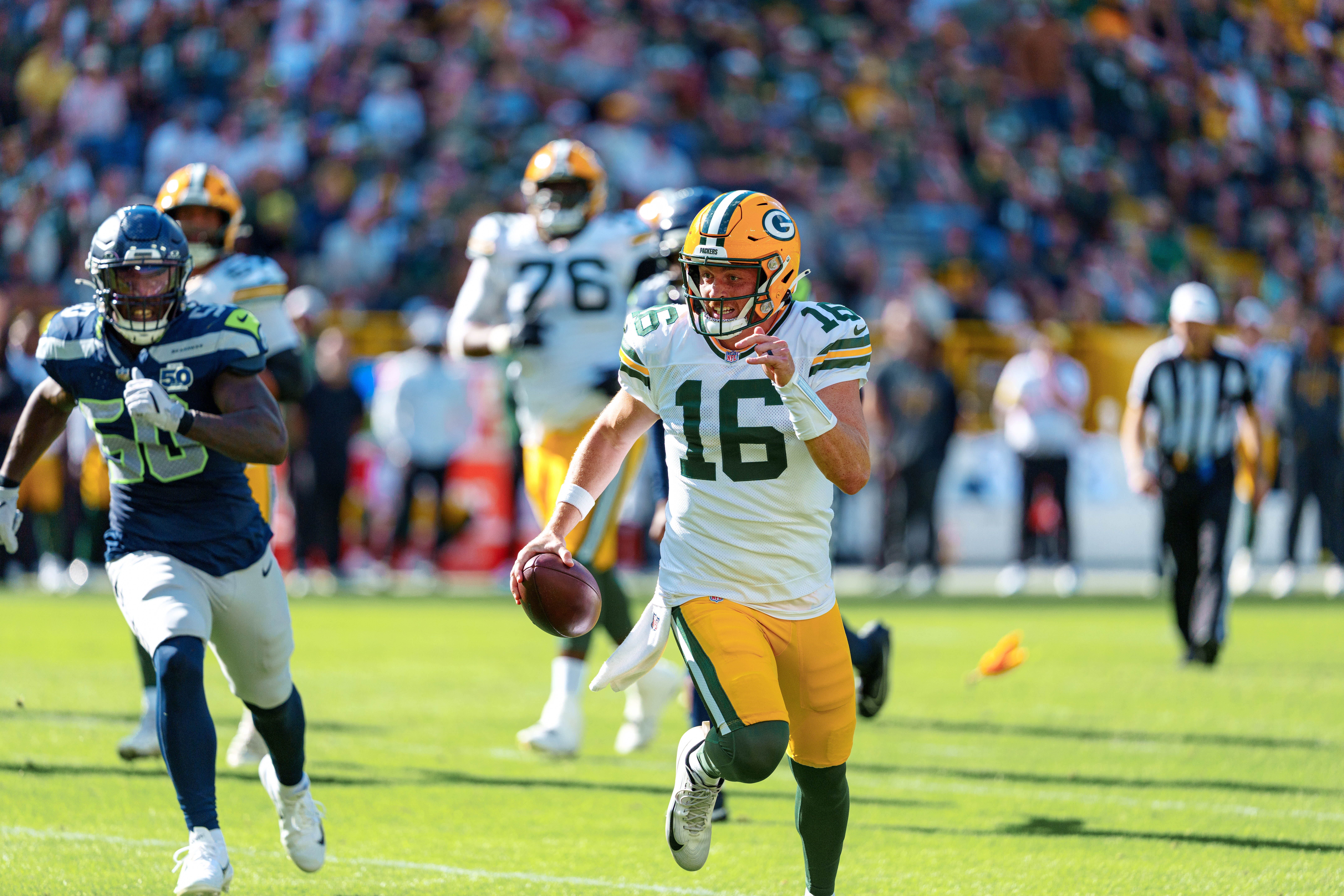 Green Bay Packers quarterback Sean Clifford (16) runs for the sideline against theSeattle Seahawks at Lambeau Field on August 23, 2025 in Green Bay, Wisconsin. Photography by Ross Harried for Second Crop Sports.