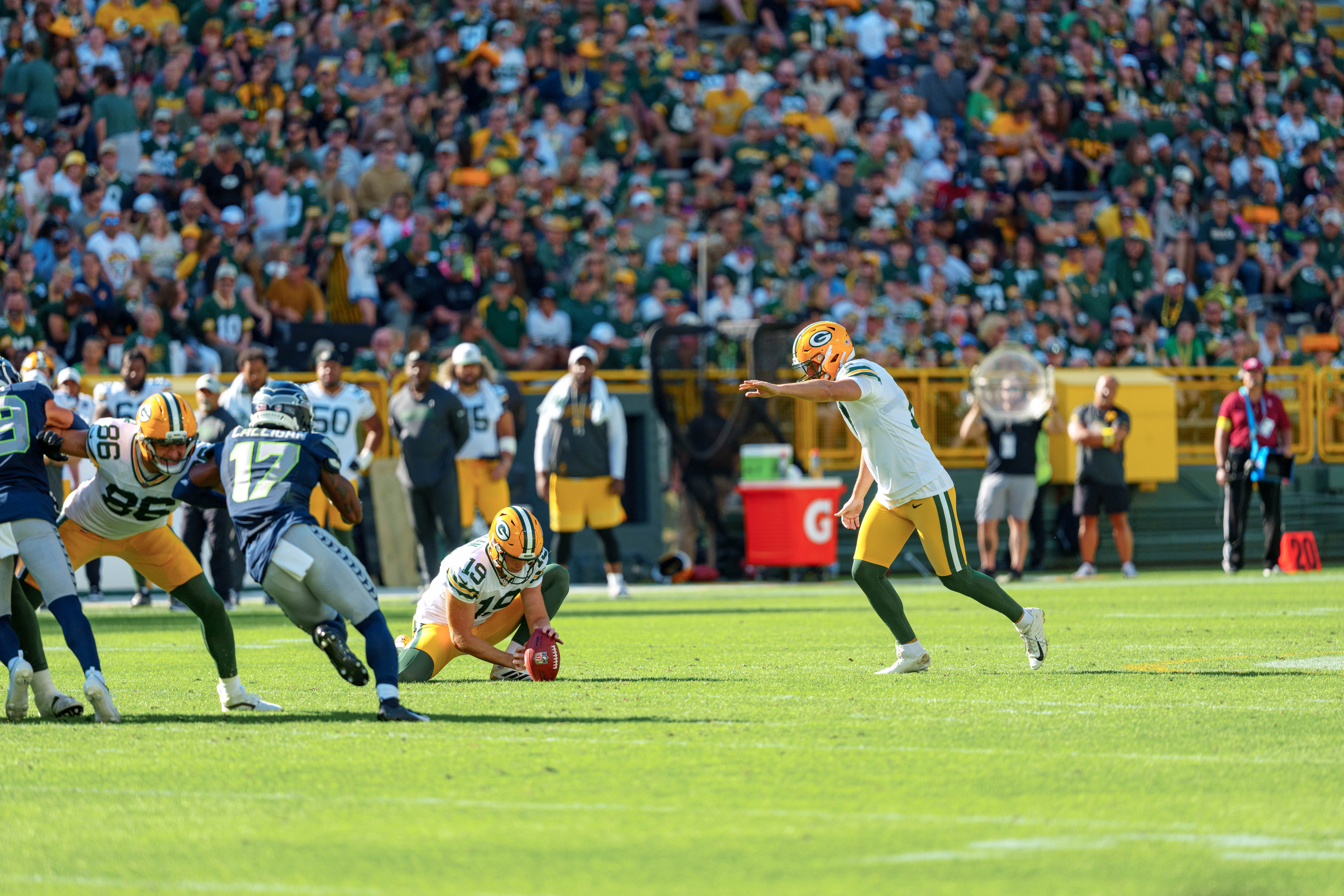 Green Bay Packers quarterback Taylor Elgersma (19) takes a long snap while kicker Brandon McManus (17) gets ready to kick a field goal in the second quarter against the Seattle Seahawks at Lambeau Field on August 23, 2025 in Green Bay, Wisconsin. Photography by Ross Harried for Second Crop Sports.