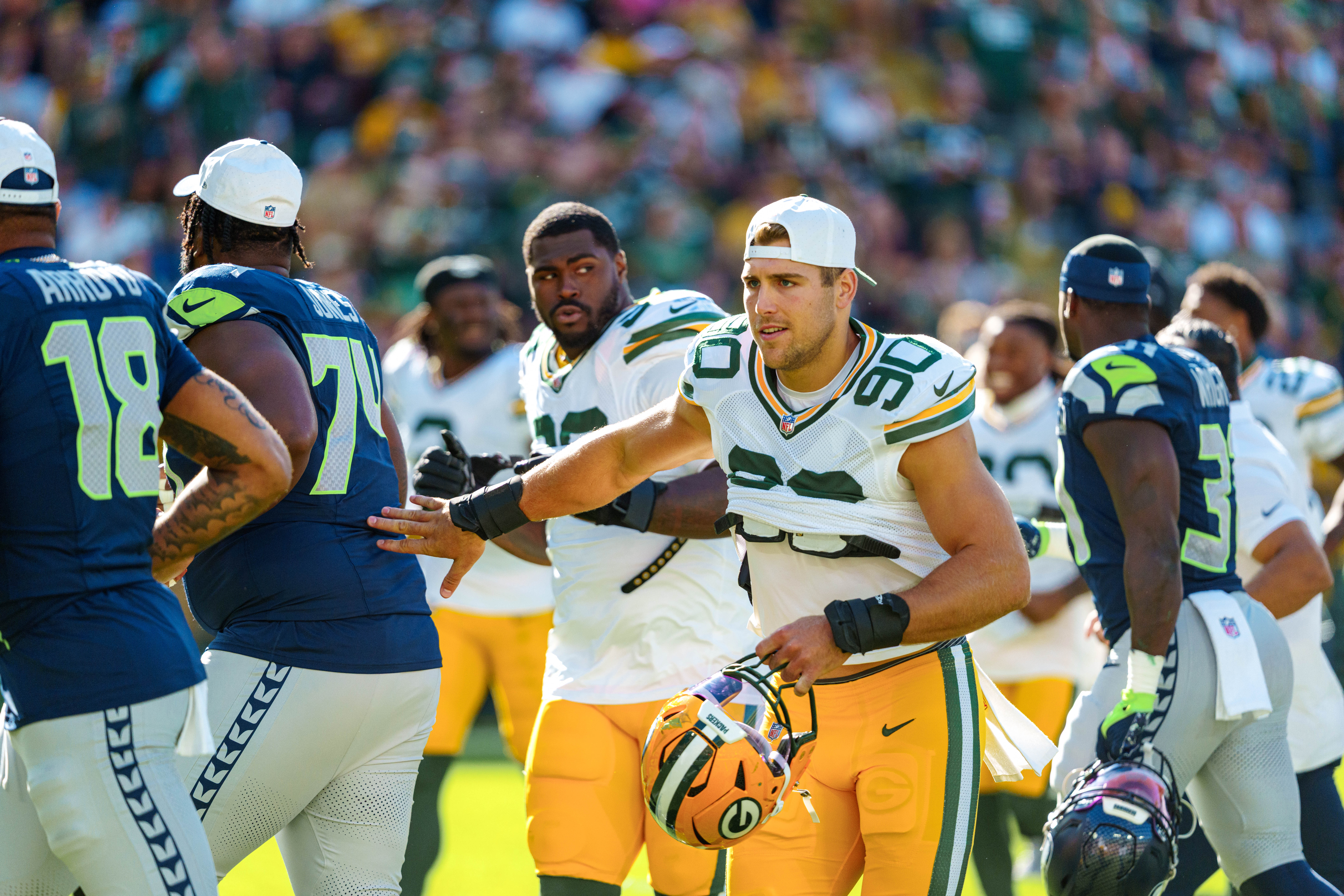 Green Bay Packers defensive end Lukas Van Ness (90) heads to the locker room at halftime against the Seattle Seahawks at Lambeau Field on August 23, 2025 in Green Bay, Wisconsin. Photography by Ross Harried for Second Crop Sports.
