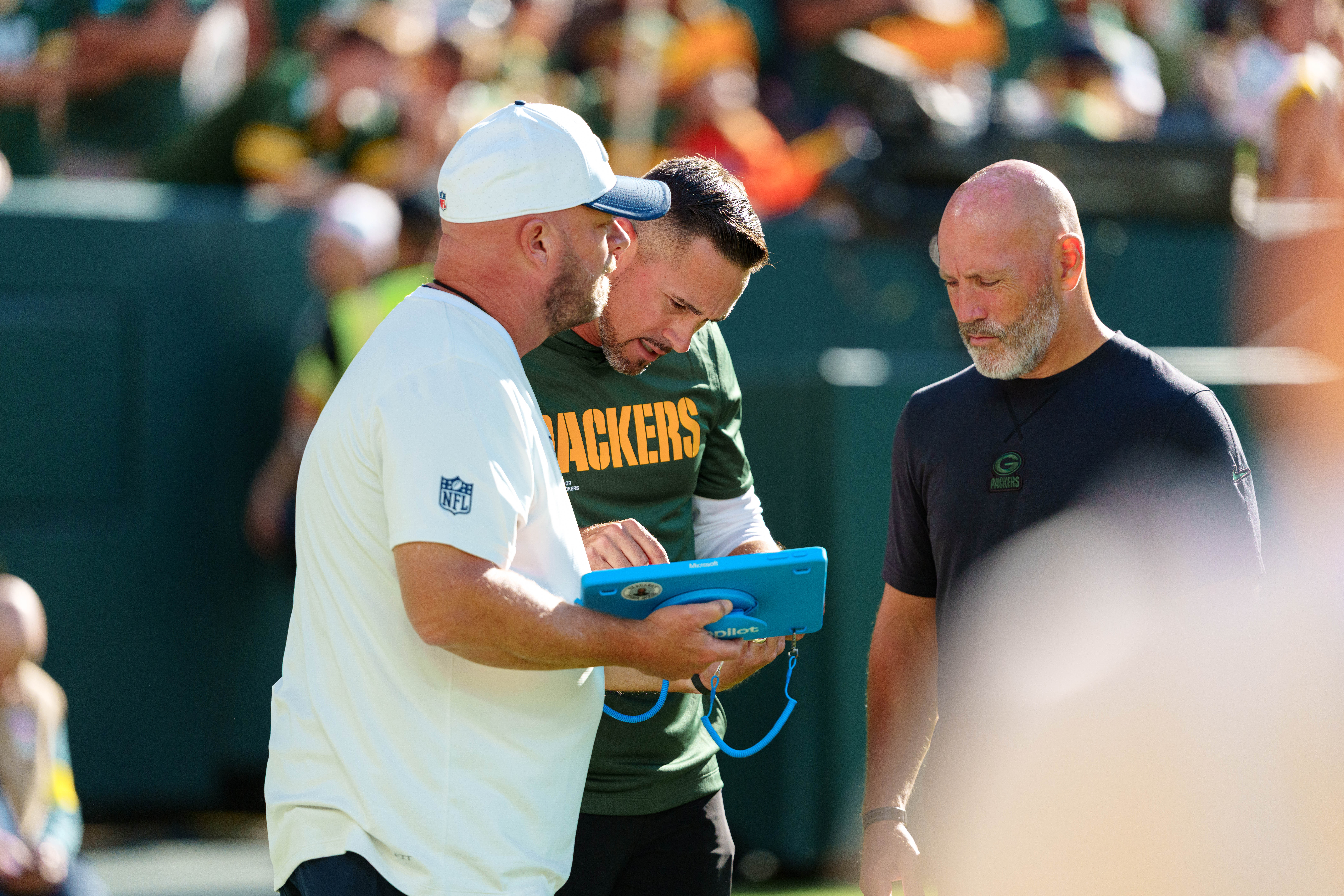 Green Bay Packers head coach Matt LaFleur looks at a tablet after halftime against the Seattle Seahawks at Lambeau Field on August 23, 2025 in Green Bay, Wisconsin. Photography by Ross Harried for Second Crop Sports.