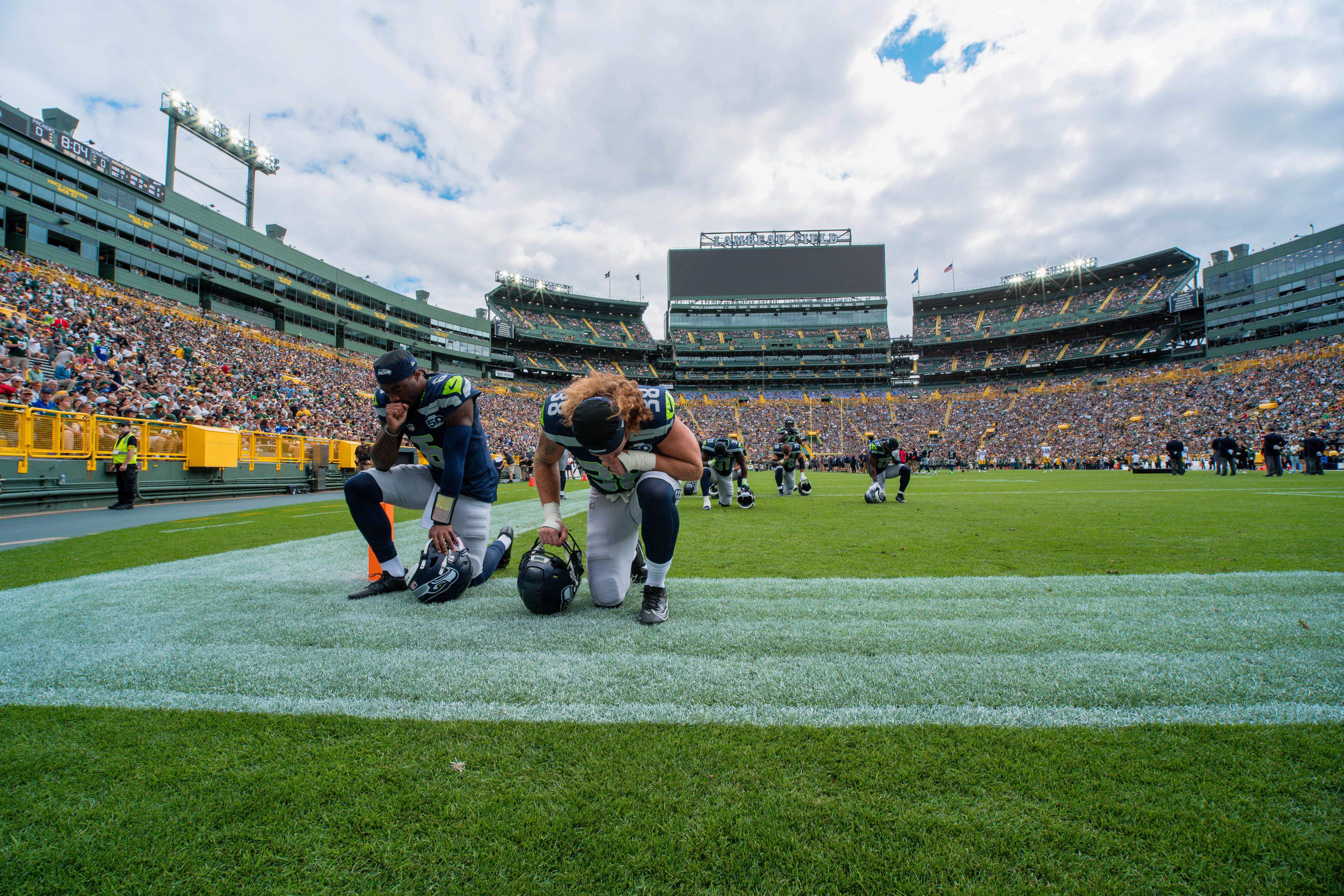 Seattle Seahawks quarterback Jalen Milroe (6) and fullback Brady Russell (38) take a knee in the end zone before taking on theGreen Bay Packers at Lambeau Field on August 23, 2025 in Green Bay, Wisconsin. Photography by Ross Harried for Second Crop Sports.