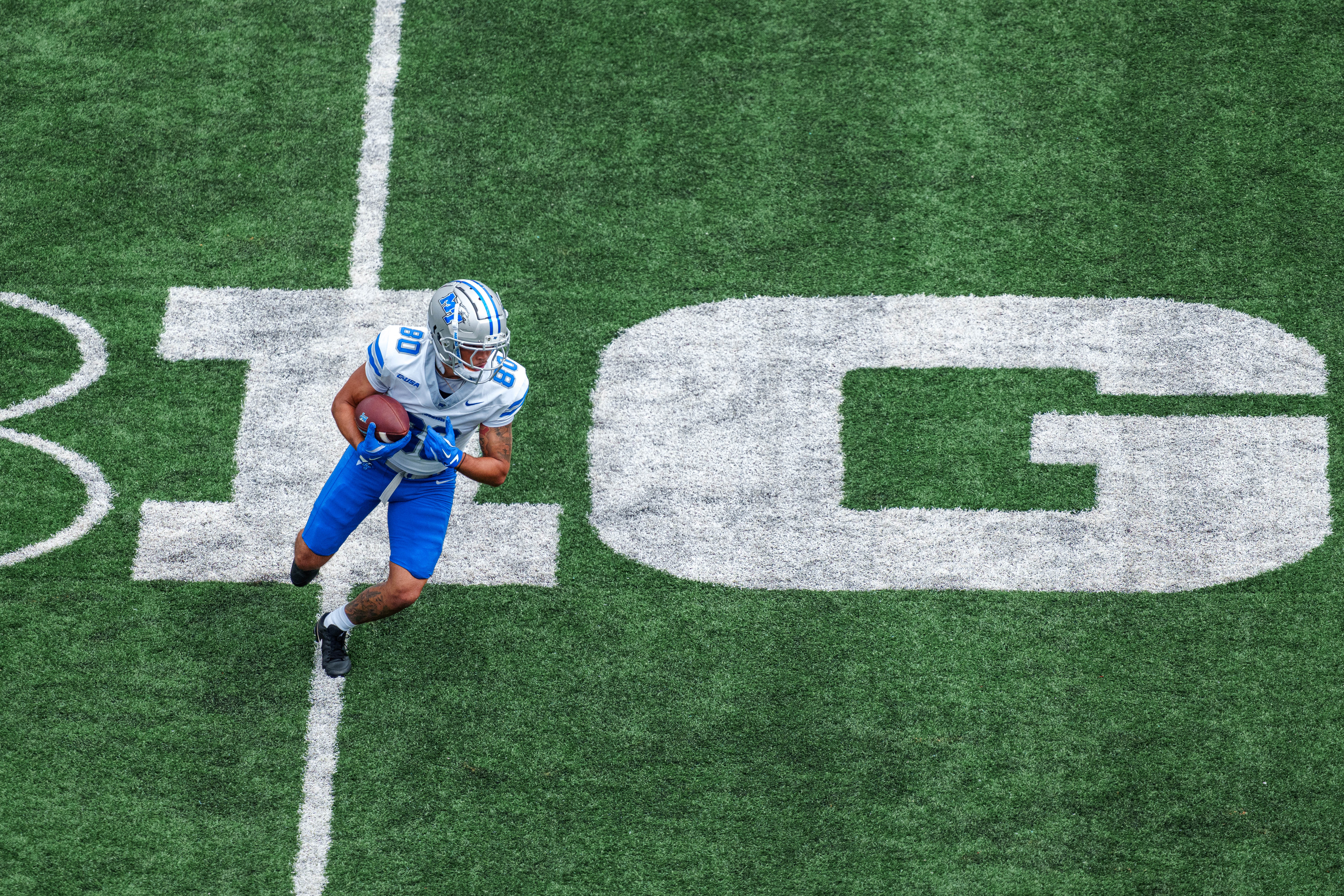 Sept 6, 2025; Madison, Wisconsin, USA; Middle Tennessee Blue Raiders wide receiver Zaidyn Moore (80) warms up before a college football game between the Wisconsin Badgers and the Middle Tennessee Blue Raiders at Camp Randall Stadium on September 06, 2025 in Madison, Wisconsin. Photography by Ross Harried for Second Crop Sports.
