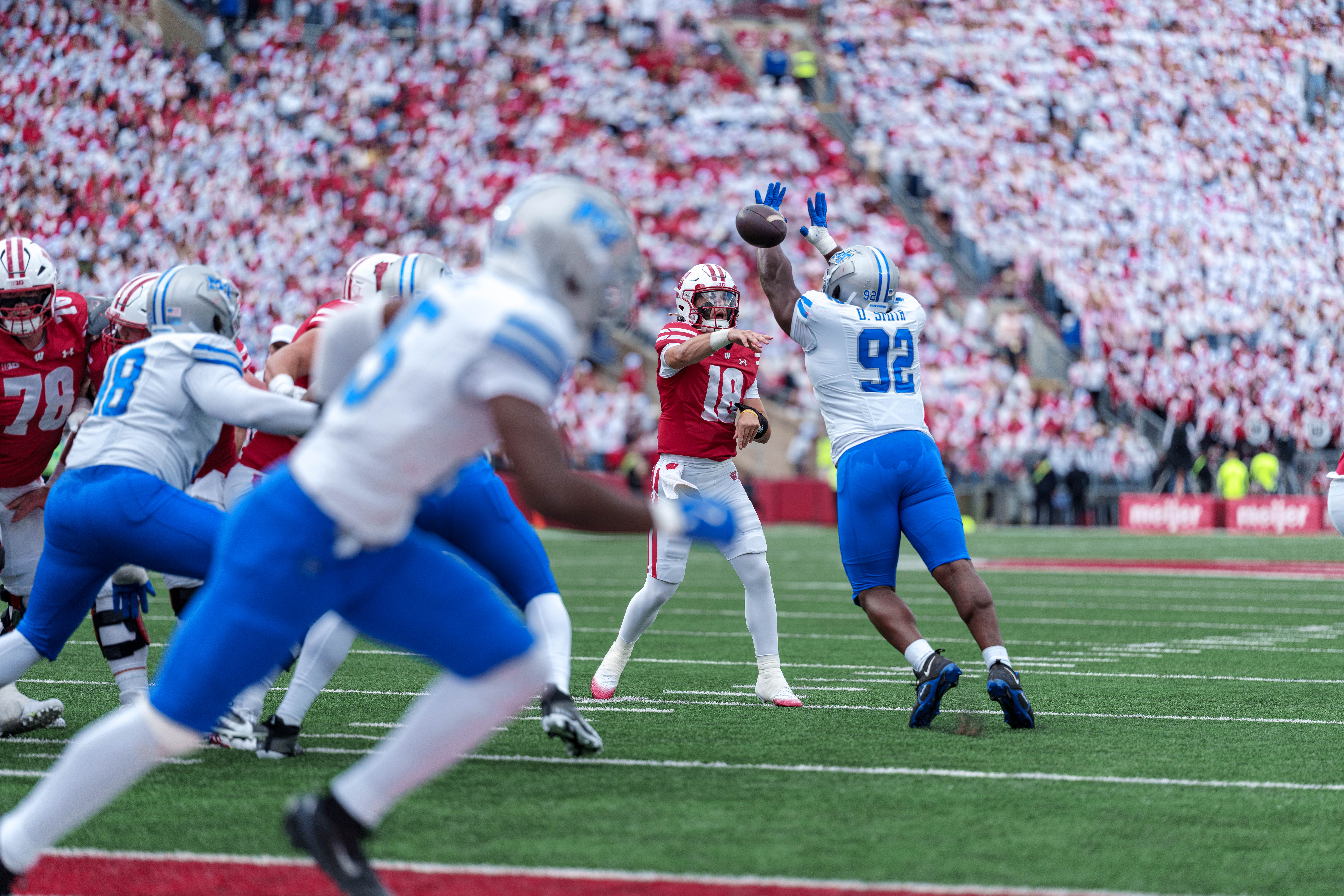Sept 6, 2025; Madison, Wisconsin, USA; Wisconsin Badgers quarterback Danny O'Neil (18) attempts a pass durning a college football game between the Wisconsin Badgers and the Middle Tennessee Blue Raiders at Camp Randall Stadium on September 06, 2025 in Madison, Wisconsin. Photography by Ross Harried for Second Crop Sports.