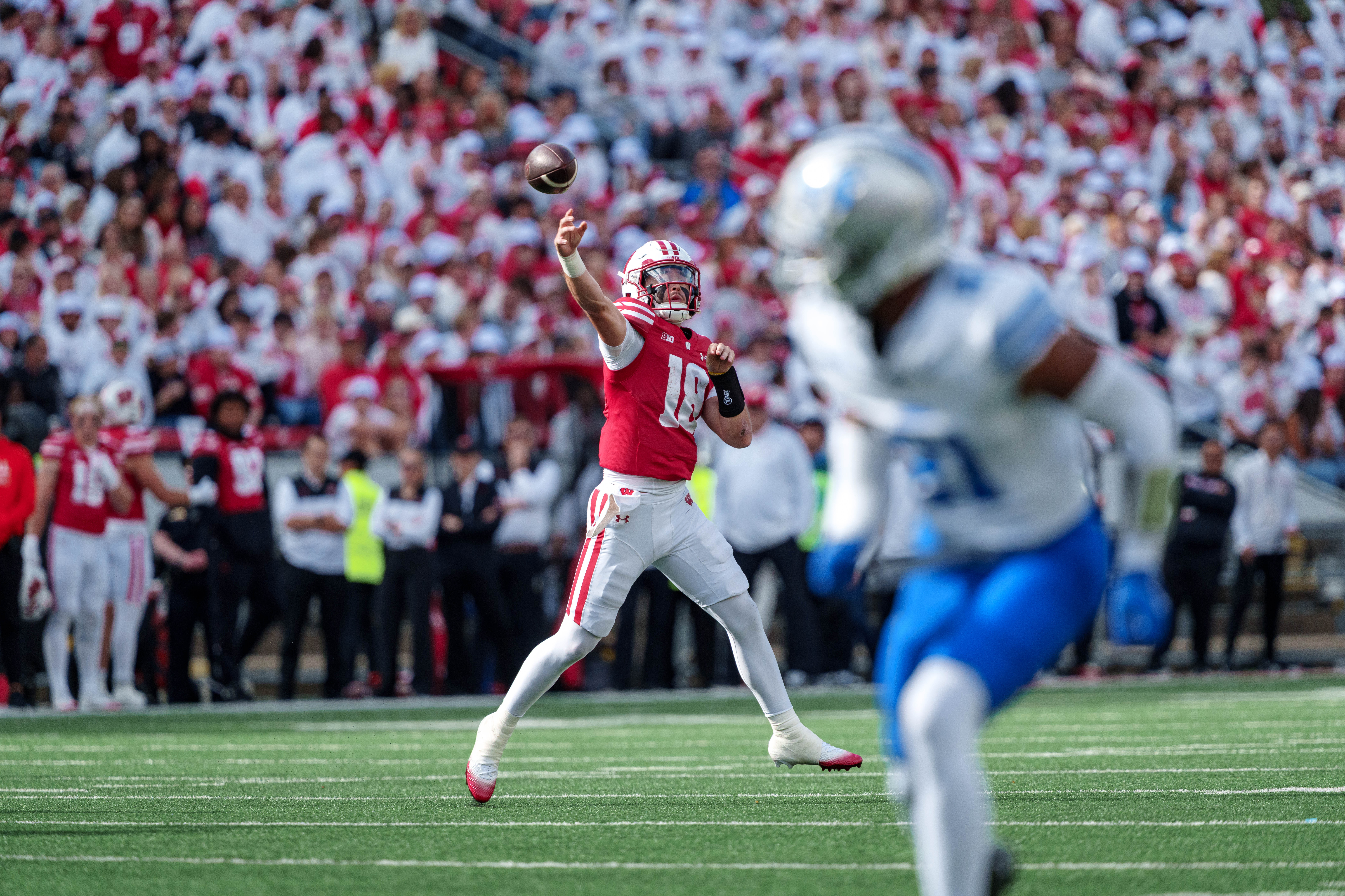 Sept 6, 2025; Madison, Wisconsin, USA; Wisconsin Badgers quarterback Danny O'Neil (18) attempts a pass durning a college football game between the Wisconsin Badgers and the Middle Tennessee Blue Raiders at Camp Randall Stadium on September 06, 2025 in Madison, Wisconsin. Photography by Ross Harried for Second Crop Sports.