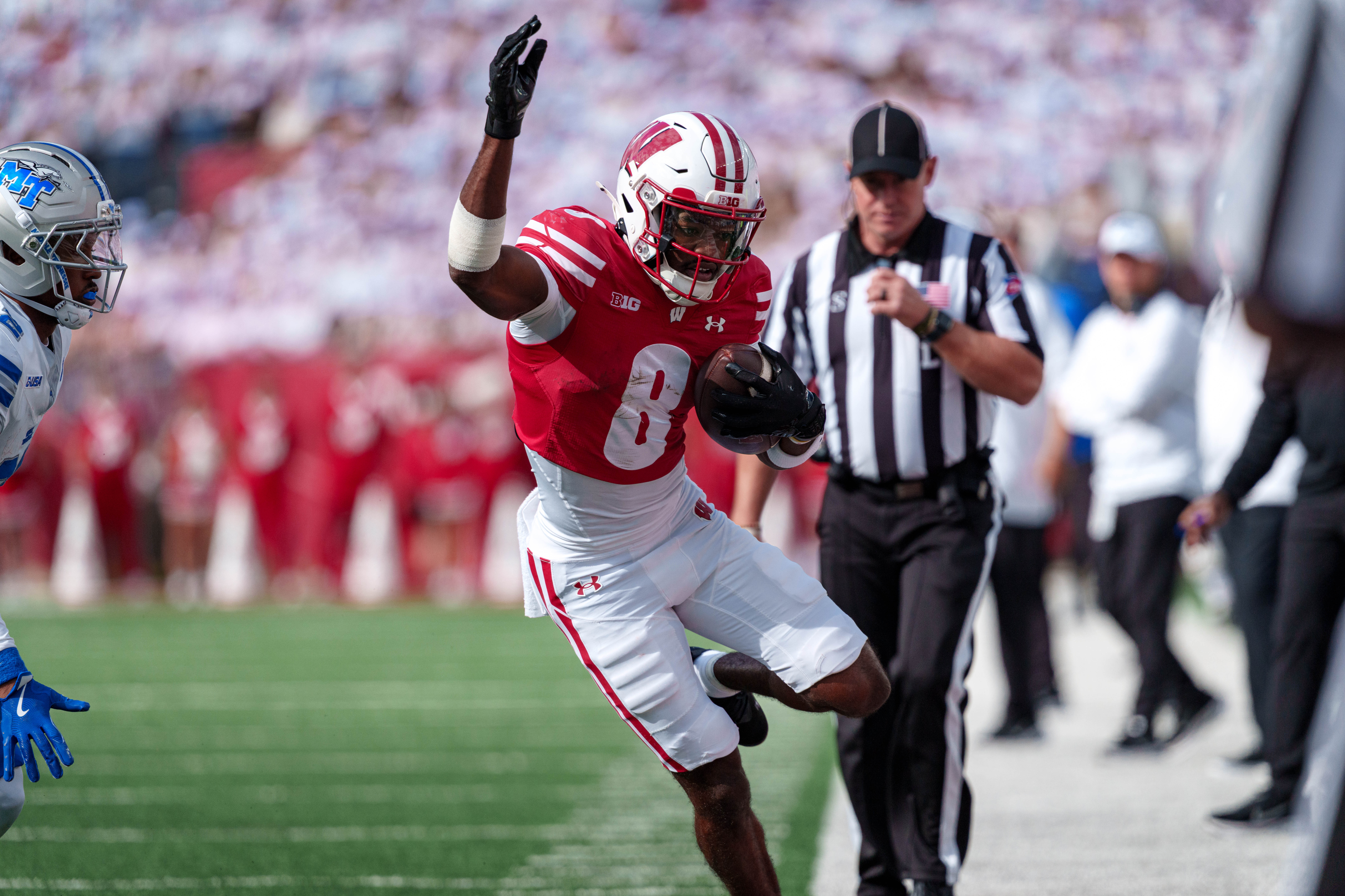 Sept 6, 2025; Madison, Wisconsin, USA; Wisconsin Badgers wide receiver Vinny Anthony II (8) tries to stay inbounds after a catch durning a college football game between the Wisconsin Badgers and the Middle Tennessee Blue Raiders at Camp Randall Stadium on September 06, 2025 in Madison, Wisconsin. Photography by Ross Harried for Second Crop Sports.