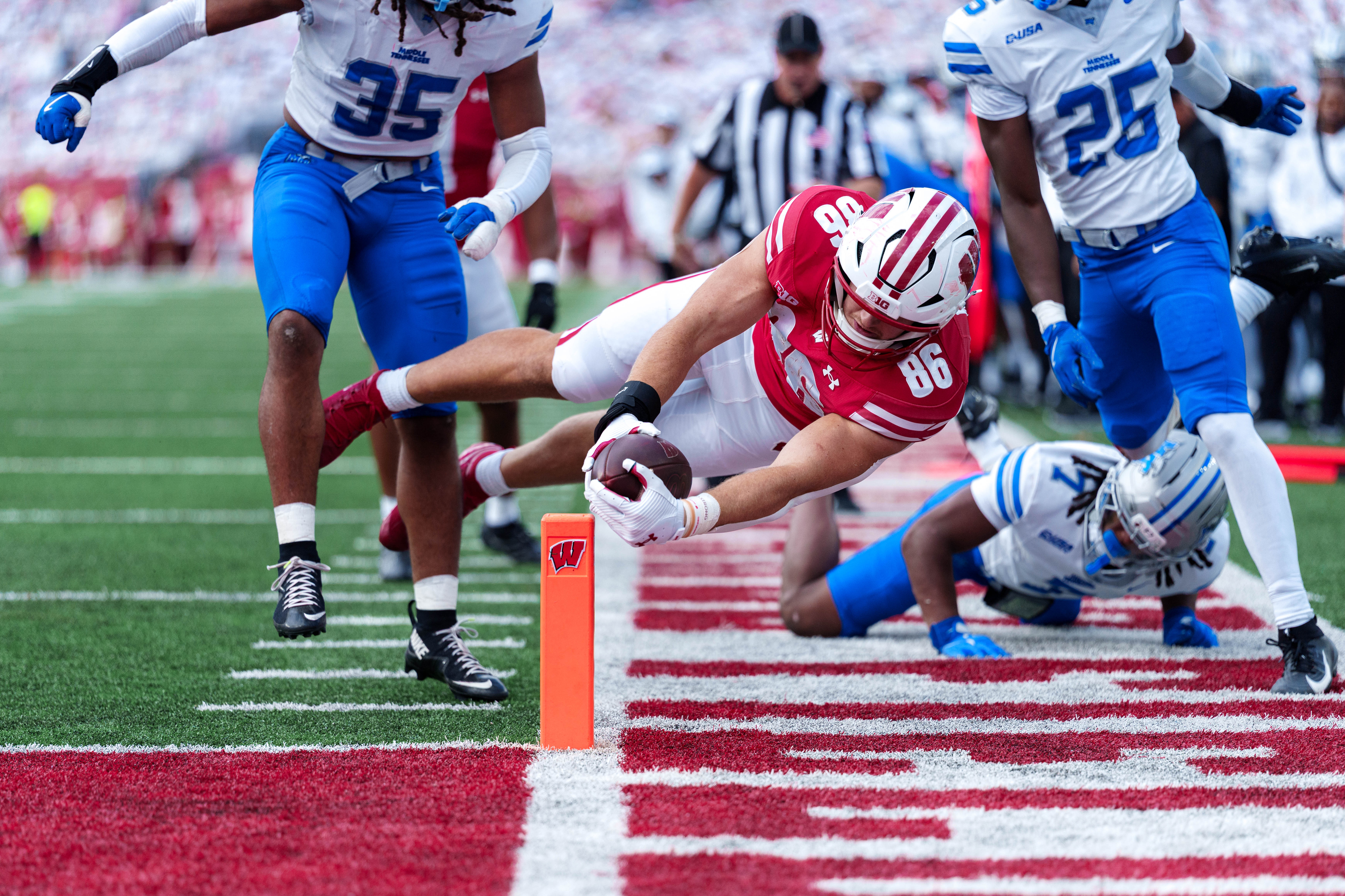 Sept 6, 2025; Madison, Wisconsin, USA; Wisconsin Badgers tight end Lance Mason (86) dives for end zone durning a college football game between the Wisconsin Badgers and the Middle Tennessee Blue Raiders at Camp Randall Stadium on September 06, 2025 in Madison, Wisconsin. Photography by Ross Harried for Second Crop Sports.