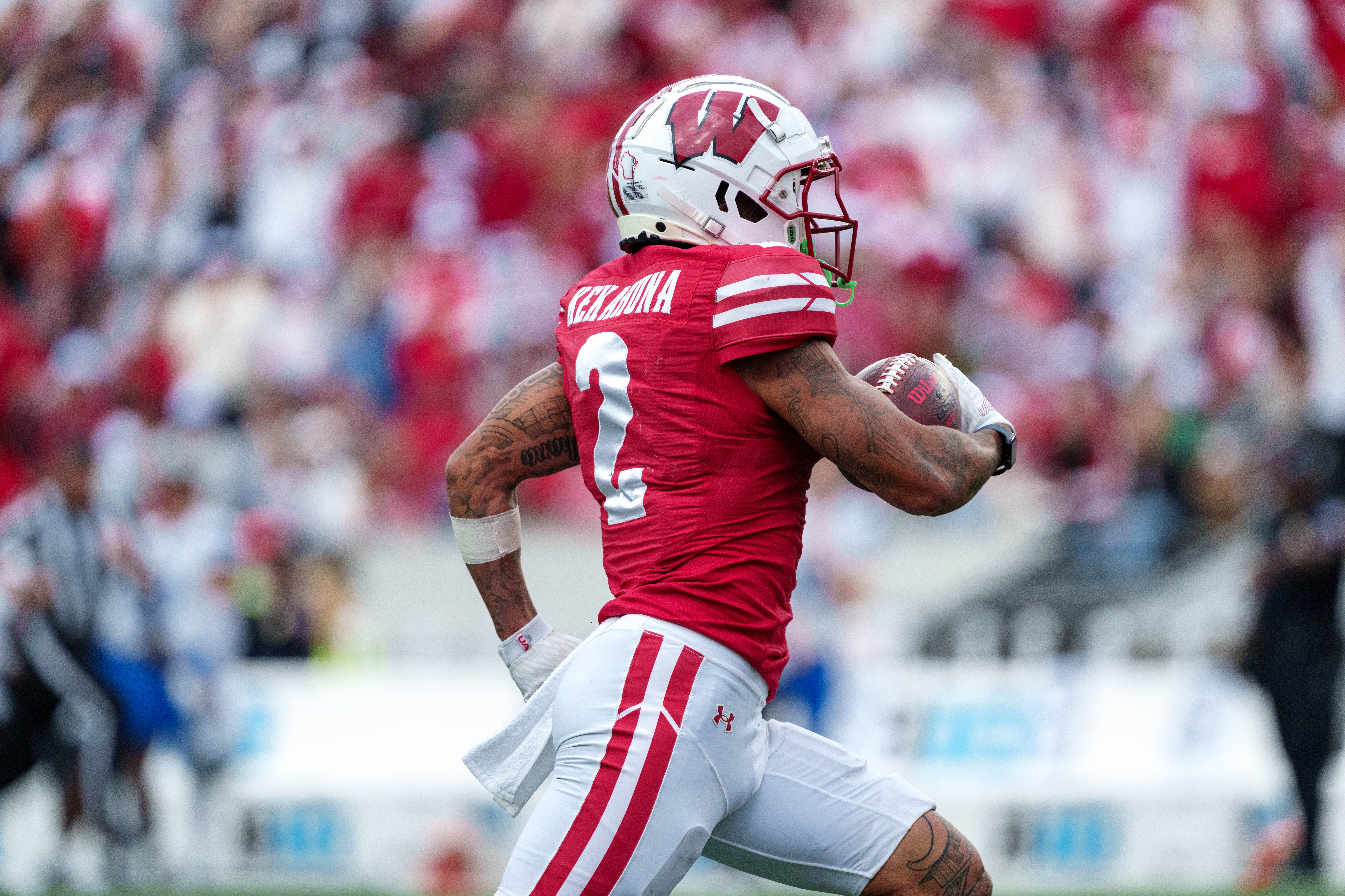 Sept 6, 2025; Madison, Wisconsin, USA; Wisconsin Badgers wide receiver Trech Kekahuna (2) runs the ball upfield durning a college football game between the Wisconsin Badgers and the Middle Tennessee Blue Raiders at Camp Randall Stadium on September 06, 2025 in Madison, Wisconsin. Photography by Ross Harried for Second Crop Sports.