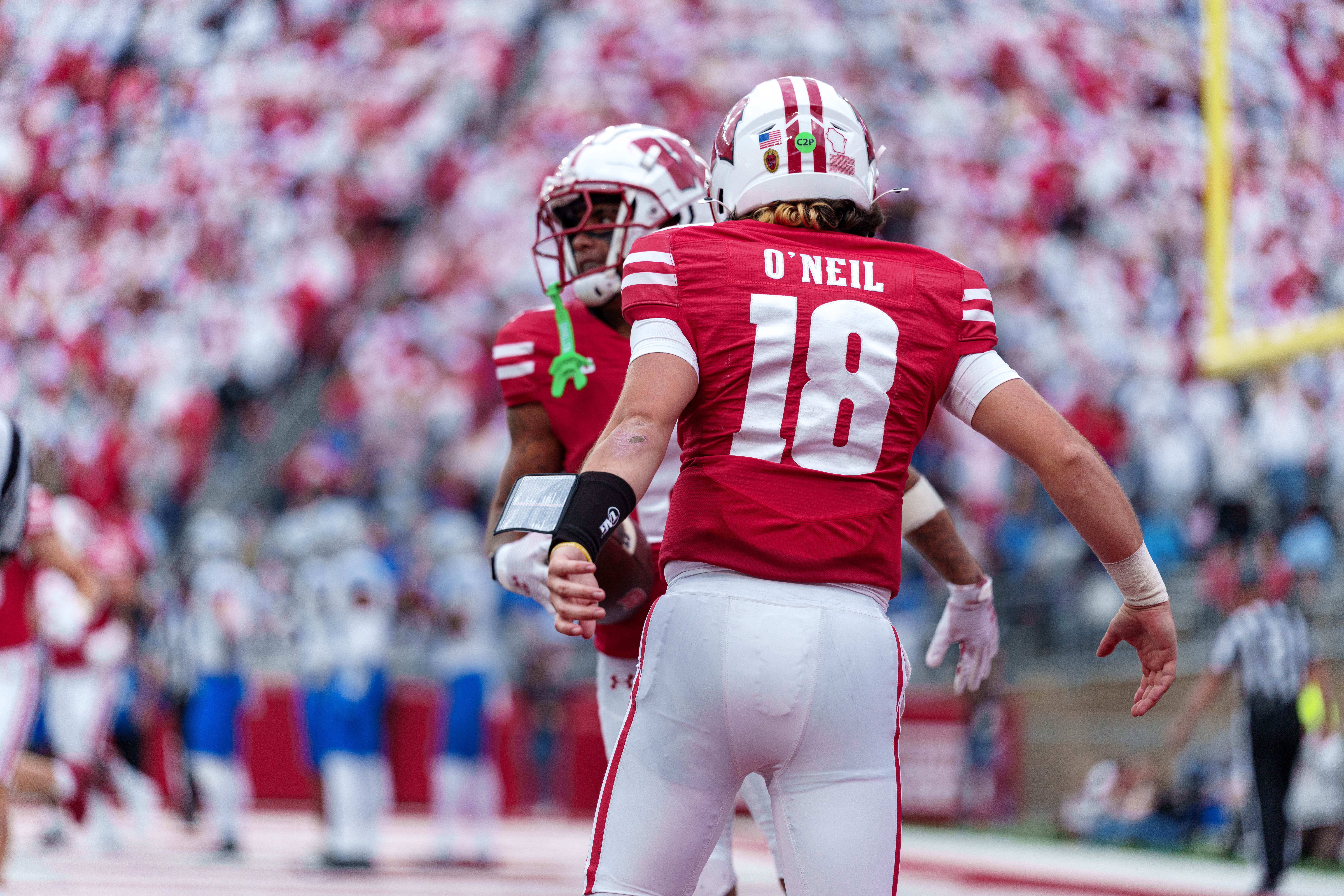 Sept 6, 2025; Madison, Wisconsin, USA; Wisconsin Badgers quarterback Danny O'Neil (18) celebrates a touchdown durning a college football game between the Wisconsin Badgers and the Middle Tennessee Blue Raiders at Camp Randall Stadium on September 06, 2025 in Madison, Wisconsin. Photography by Ross Harried for Second Crop Sports.
