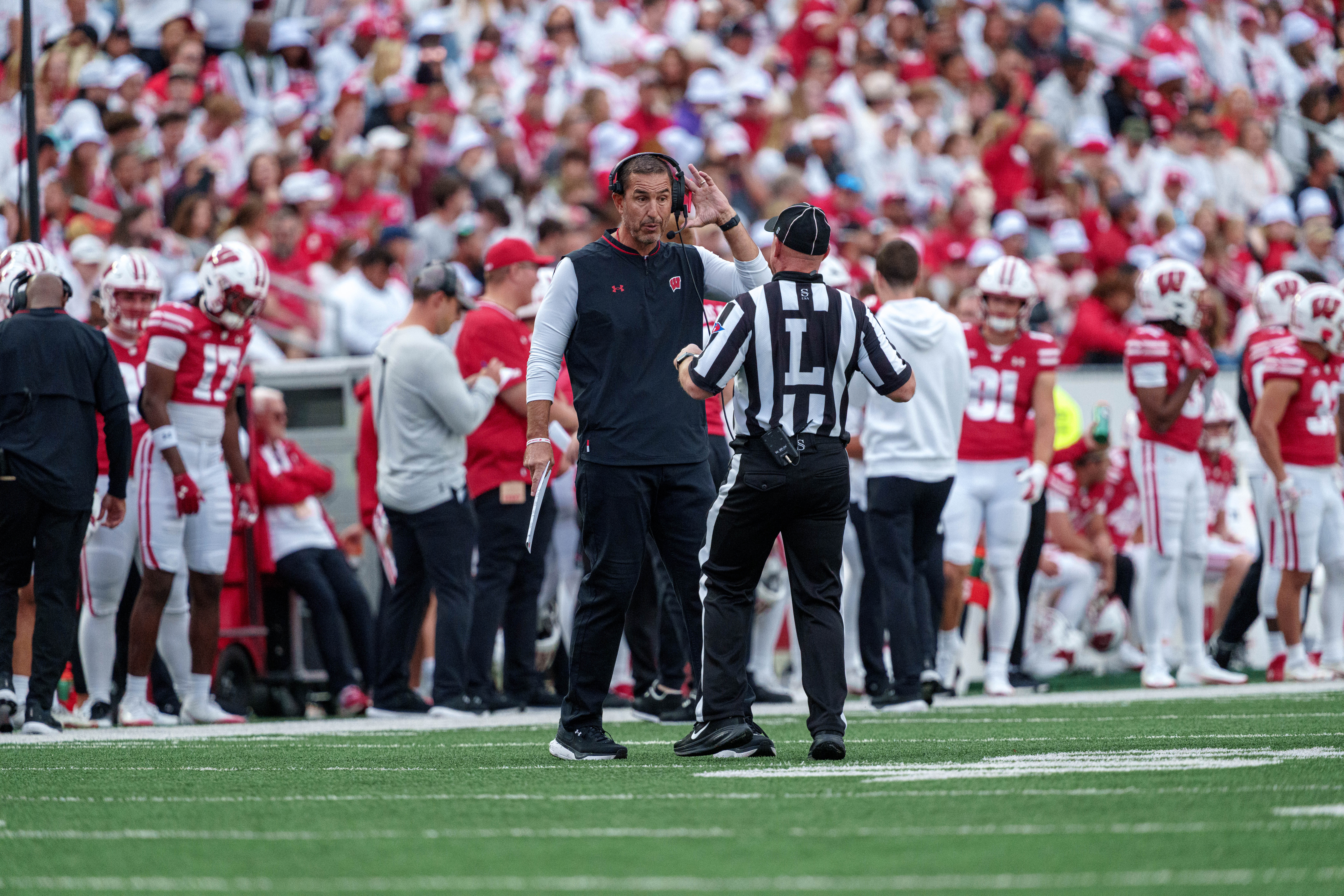 Sept 6, 2025; Madison, Wisconsin, USA; Wisconsin Badgers head coach Luke Fickell talks to the line judge durning a college football game between the Wisconsin Badgers and the Middle Tennessee Blue Raiders at Camp Randall Stadium on September 06, 2025 in Madison, Wisconsin. Photography by Ross Harried for Second Crop Sports.