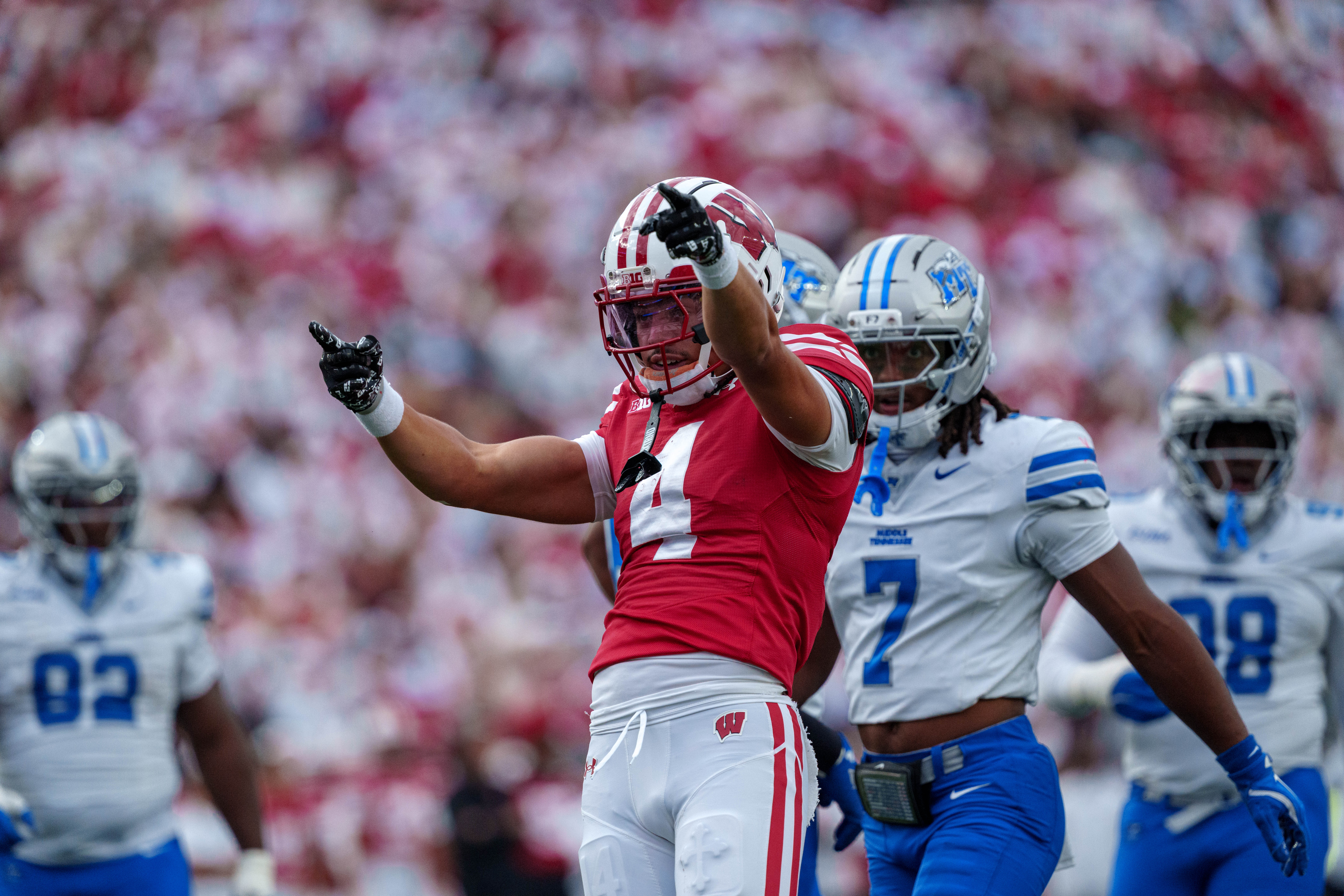 Sept 6, 2025; Madison, Wisconsin, USA; Wisconsin Badgers wide receiver Jayden Ballard (4) celebrates after the play durning a college football game between the Wisconsin Badgers and the Middle Tennessee Blue Raiders at Camp Randall Stadium on September 06, 2025 in Madison, Wisconsin. Photography by Ross Harried for Second Crop Sports.
