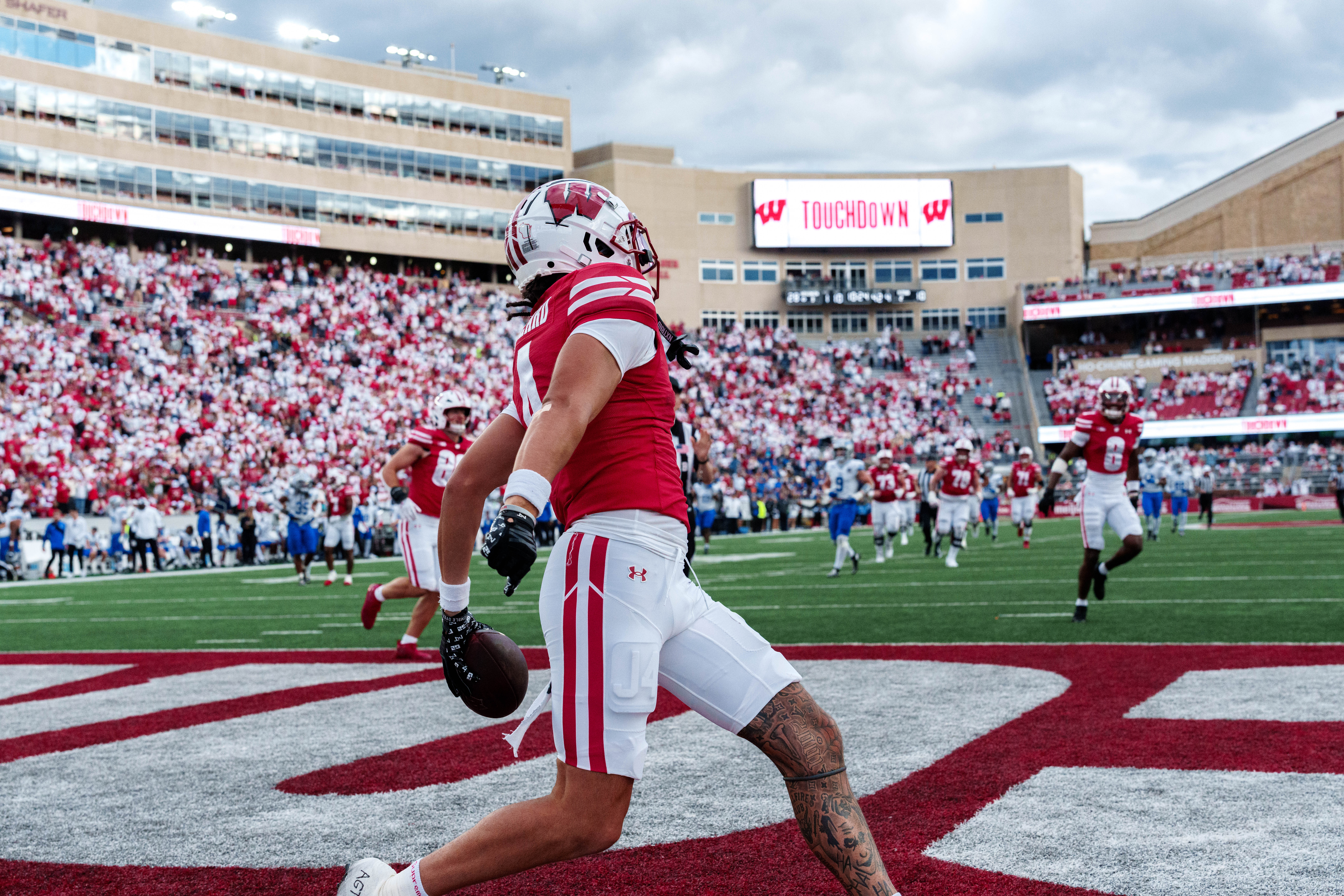 Sept 6, 2025; Madison, Wisconsin, USA; Wisconsin Badgers wide receiver Jayden Ballard (4) celebrates a touchdown durning a college football game between the Wisconsin Badgers and the Middle Tennessee Blue Raiders at Camp Randall Stadium on September 06, 2025 in Madison, Wisconsin. Photography by Ross Harried for Second Crop Sports.