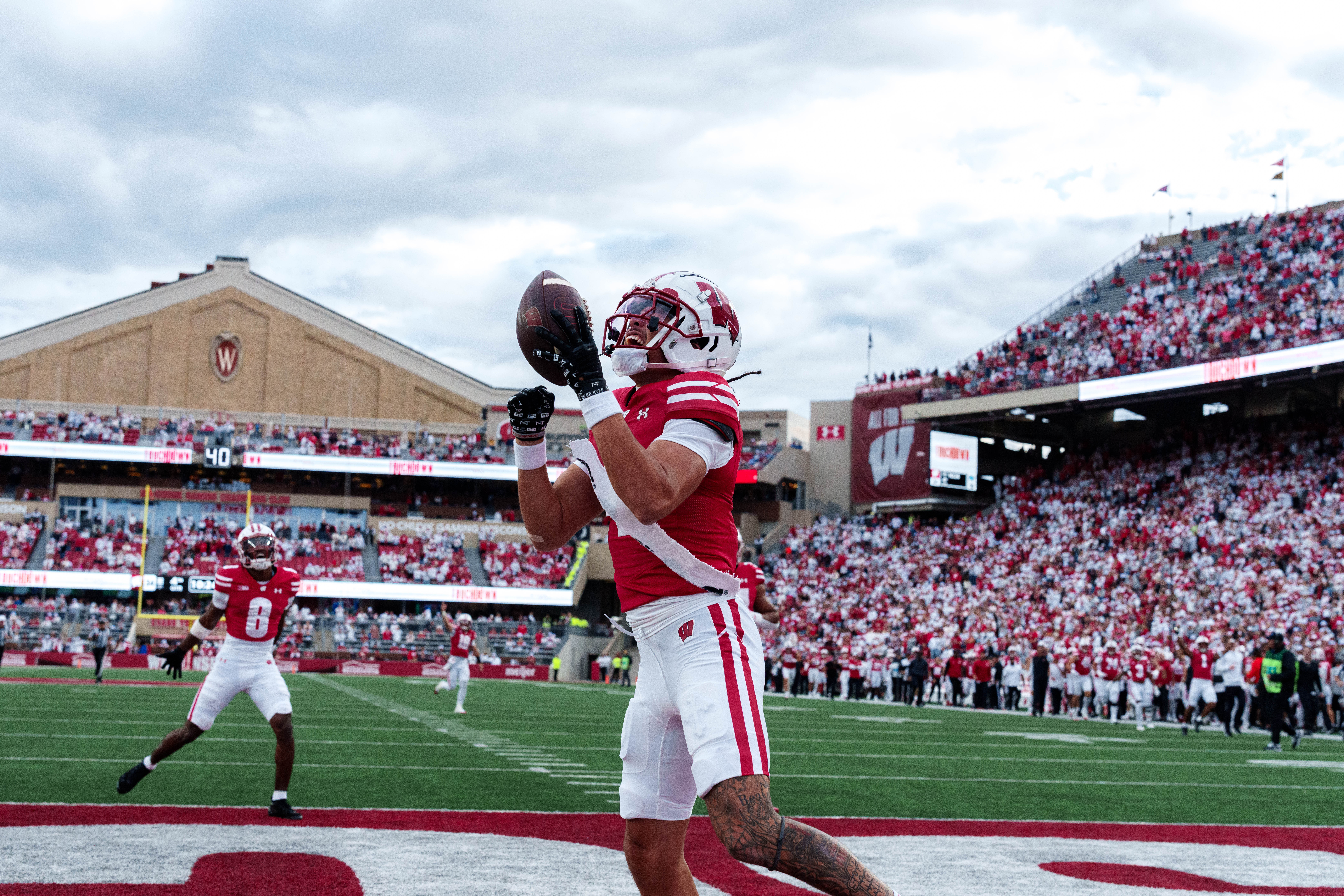 Sept 6, 2025; Madison, Wisconsin, USA; Wisconsin Badgers wide receiver Jayden Ballard (4) celebrates a touchdown durning a college football game between the Wisconsin Badgers and the Middle Tennessee Blue Raiders at Camp Randall Stadium on September 06, 2025 in Madison, Wisconsin. Photography by Ross Harried for Second Crop Sports.