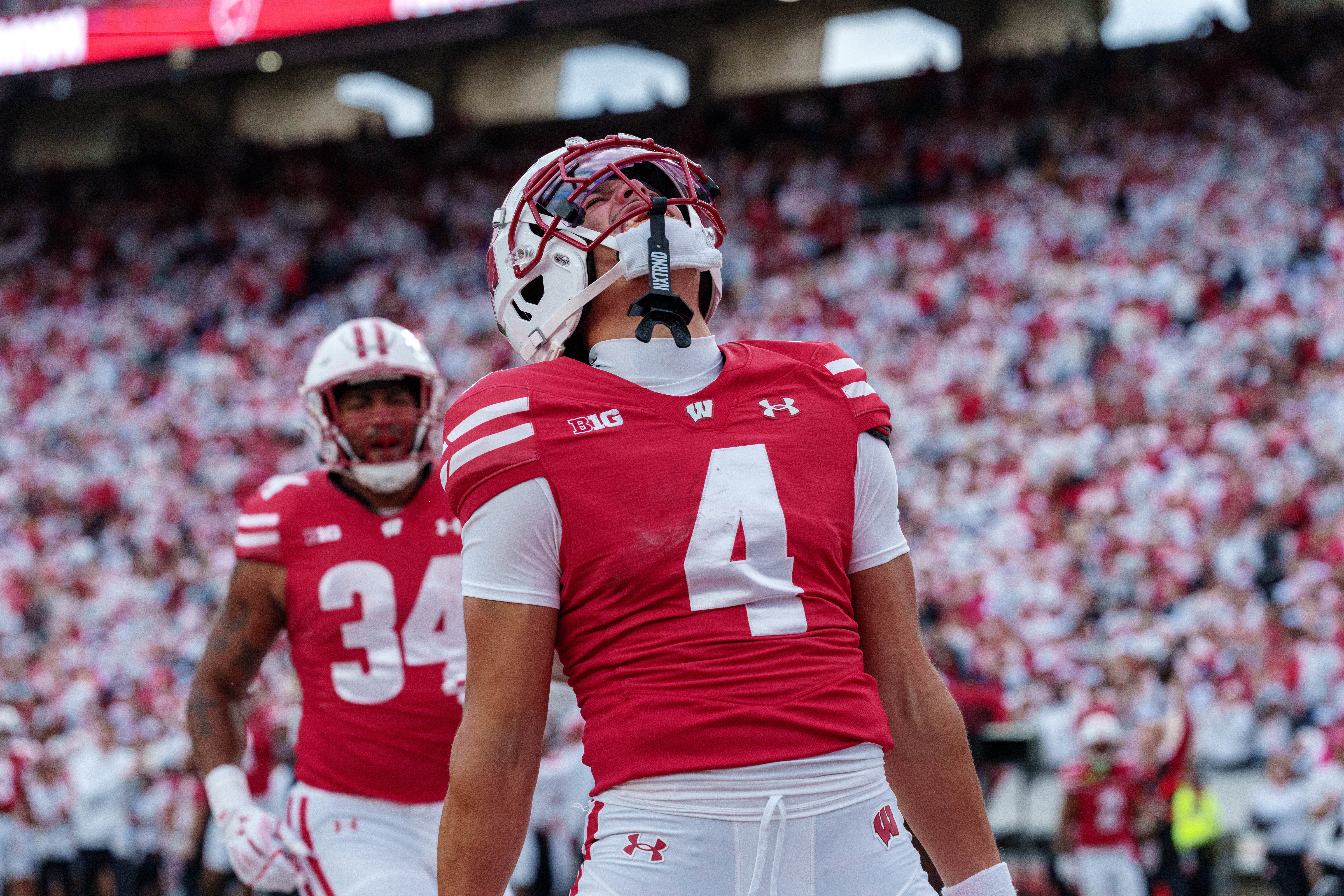 Sept 6, 2025; Madison, Wisconsin, USA; Wisconsin Badgers wide receiver Jayden Ballard (4) celebrates a touchdown durning a college football game between the Wisconsin Badgers and the Middle Tennessee Blue Raiders at Camp Randall Stadium on September 06, 2025 in Madison, Wisconsin. Photography by Ross Harried for Second Crop Sports.
