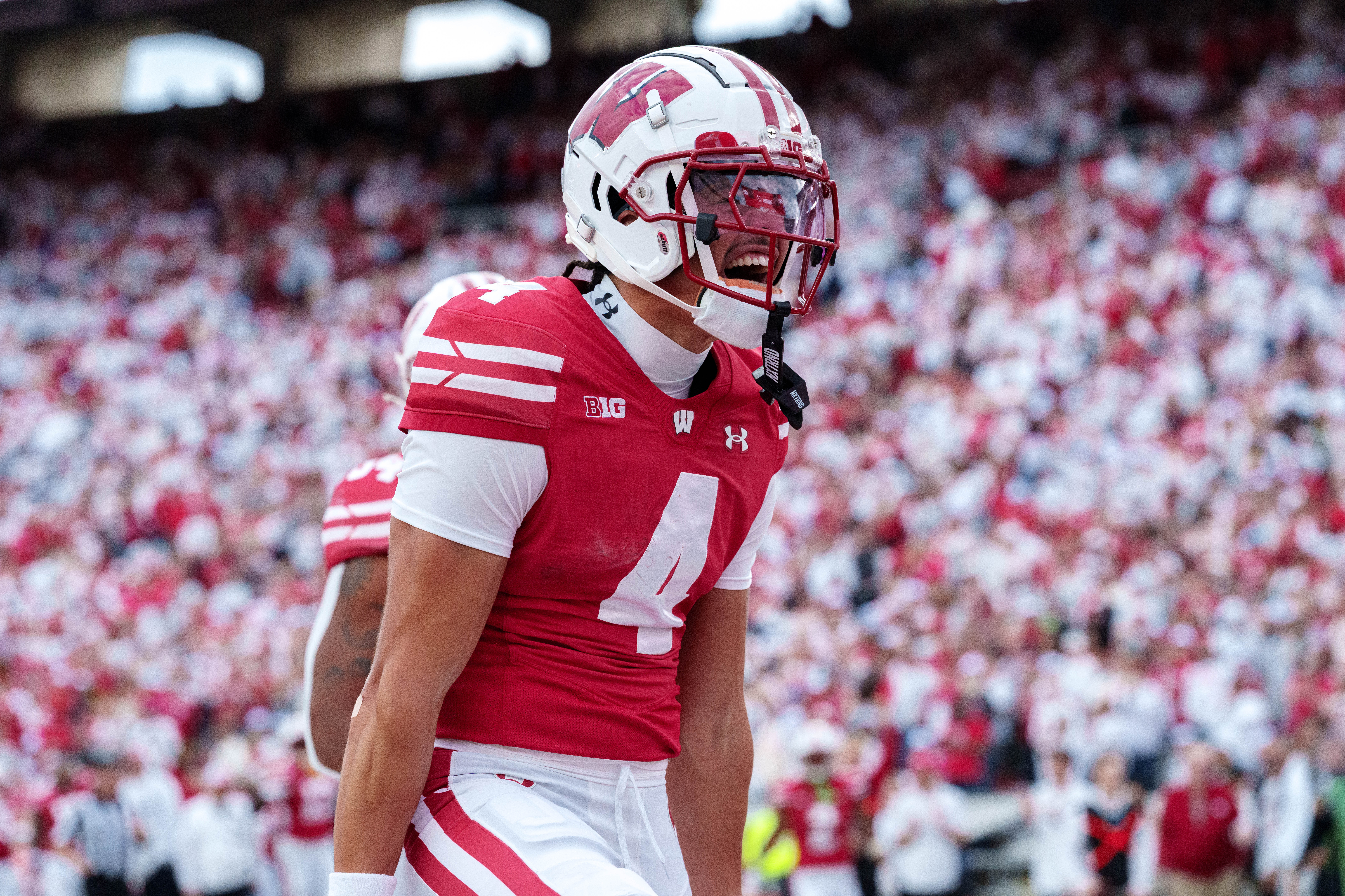 Sept 6, 2025; Madison, Wisconsin, USA; Wisconsin Badgers wide receiver Jayden Ballard (4) celebrates a touchdown durning a college football game between the Wisconsin Badgers and the Middle Tennessee Blue Raiders at Camp Randall Stadium on September 06, 2025 in Madison, Wisconsin. Photography by Ross Harried for Second Crop Sports.
