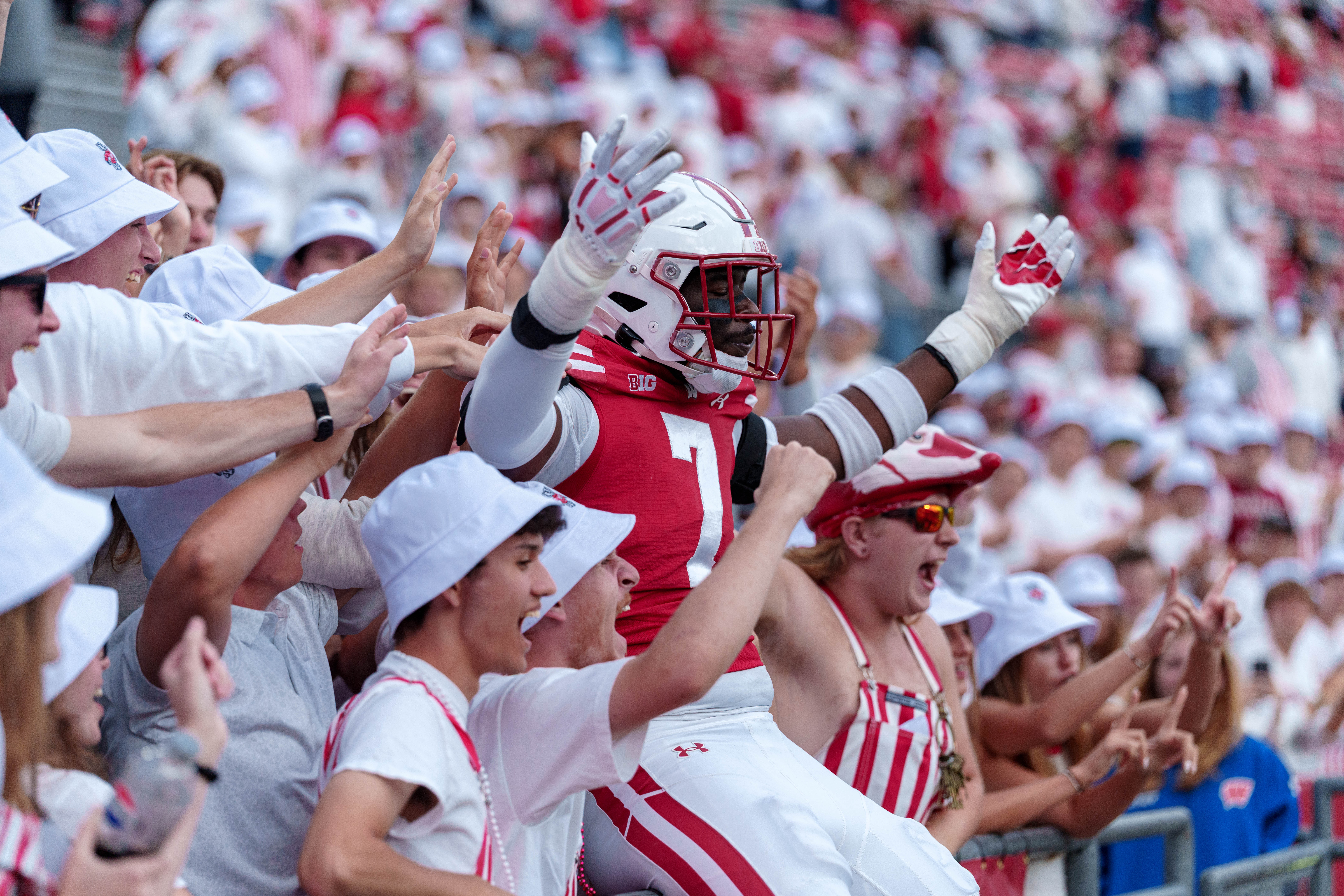 Sept 6, 2025; Madison, Wisconsin, USA; Wisconsin Badgers outside linebacker Tyreese Fearbry (7) celebrates with fans after a college football game between the Wisconsin Badgers and the Middle Tennessee Blue Raiders at Camp Randall Stadium on September 06, 2025 in Madison, Wisconsin. Photography by Ross Harried for Second Crop Sports.