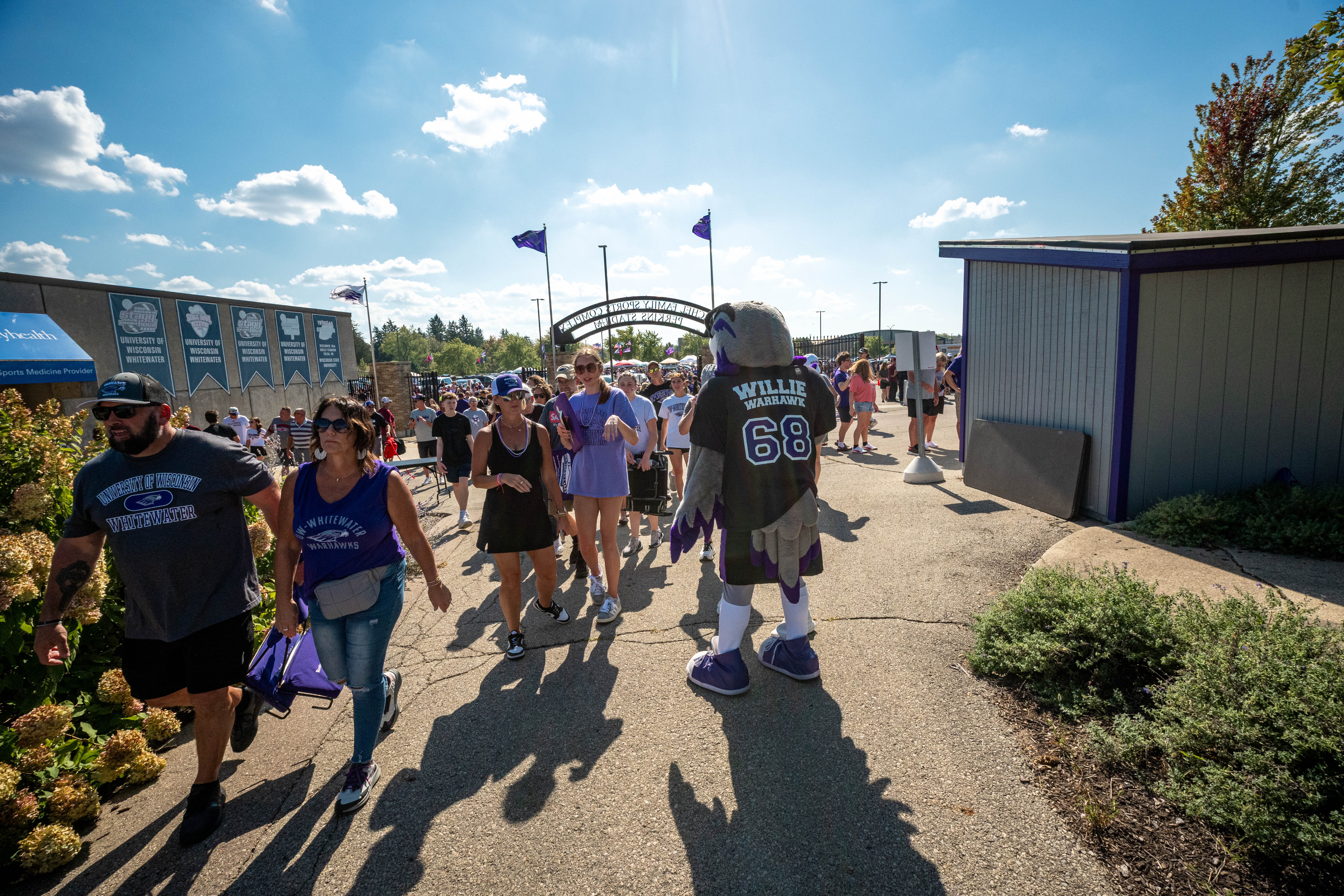 Oct 4, 2025; Whitewater, Wisconsin, USA; Willie Warhawk welcomes fans to Perkins Stadium before a college football game between the University of Wisconsin-Whitewater Warhawks and the University of Wisconsin-La Crosse Eagles on October 04, 2025 in Whitewater, Wisconsin. Photography by Ross Harried for Second Crop Sports.