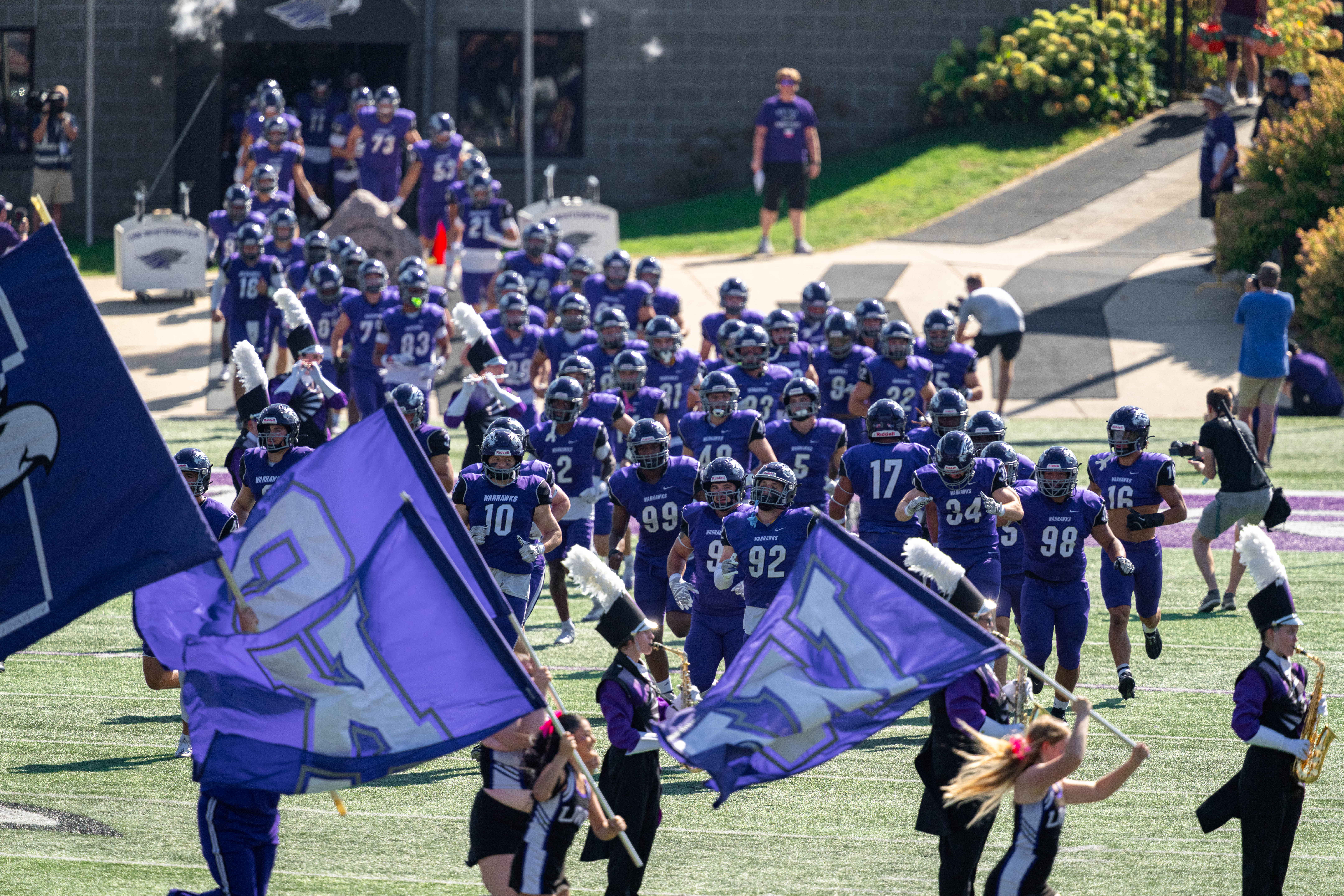 Oct 4, 2025; Whitewater, Wisconsin, USA; The University of Wisconsin-Whitewater Warhawks take the field before a college football game against the University of Wisconsin-La Crosse Eagles at Perkins Stadium on October 04, 2025 in Whitewater, Wisconsin. Photography by Ross Harried for Second Crop Sports.
