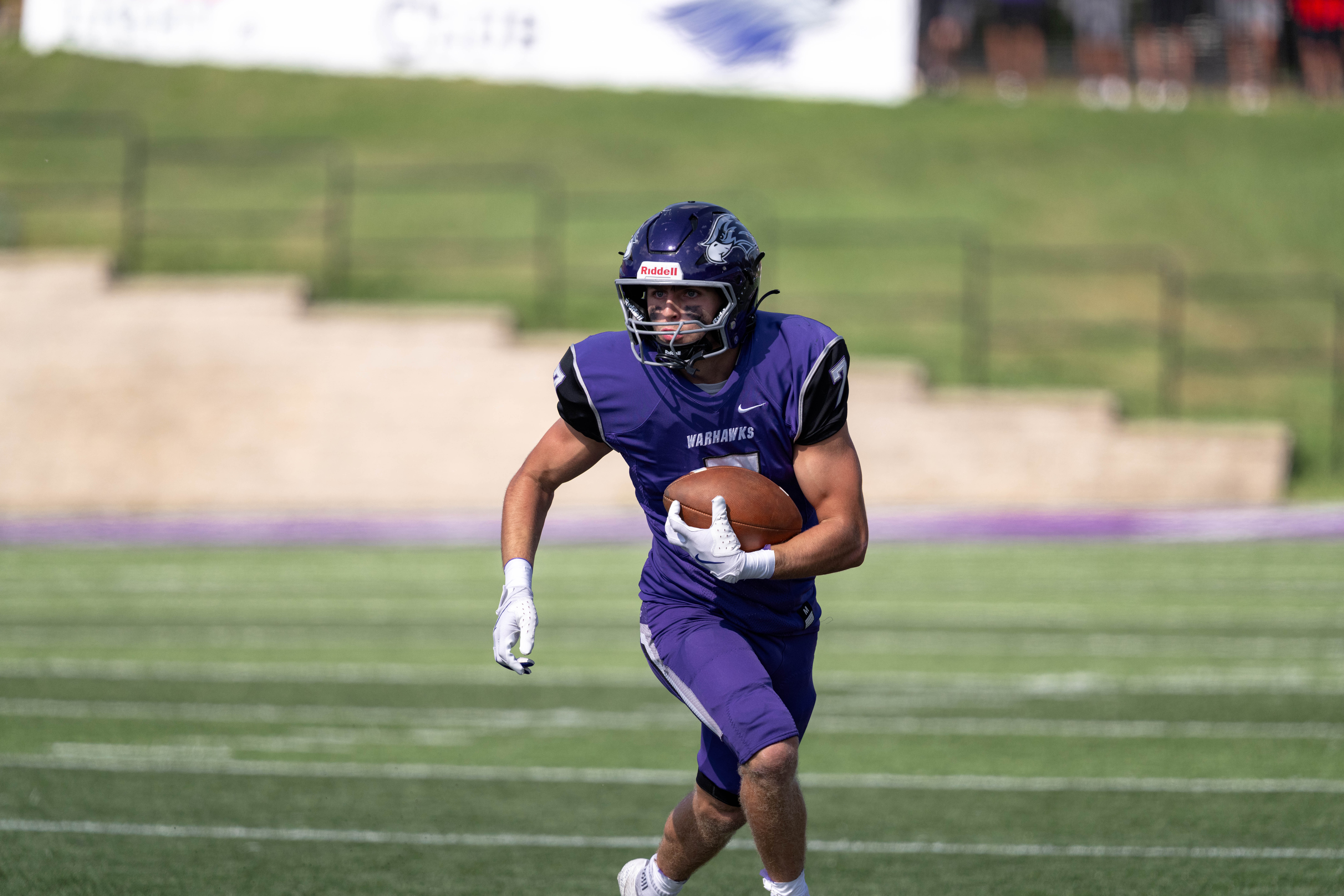 Oct 4, 2025; Whitewater, Wisconsin, USA; University of Wisconsin-Whitewater Warhawks wide receiver Tyler Vasey (7) runs after a catch durning a college football game between the University of Wisconsin-Whitewater Warhawks and the University of Wisconsin-La Crosse Eagles at Perkins Stadium on October 04, 2025 in Whitewater, Wisconsin. Photography by Ross Harried for Second Crop Sports.