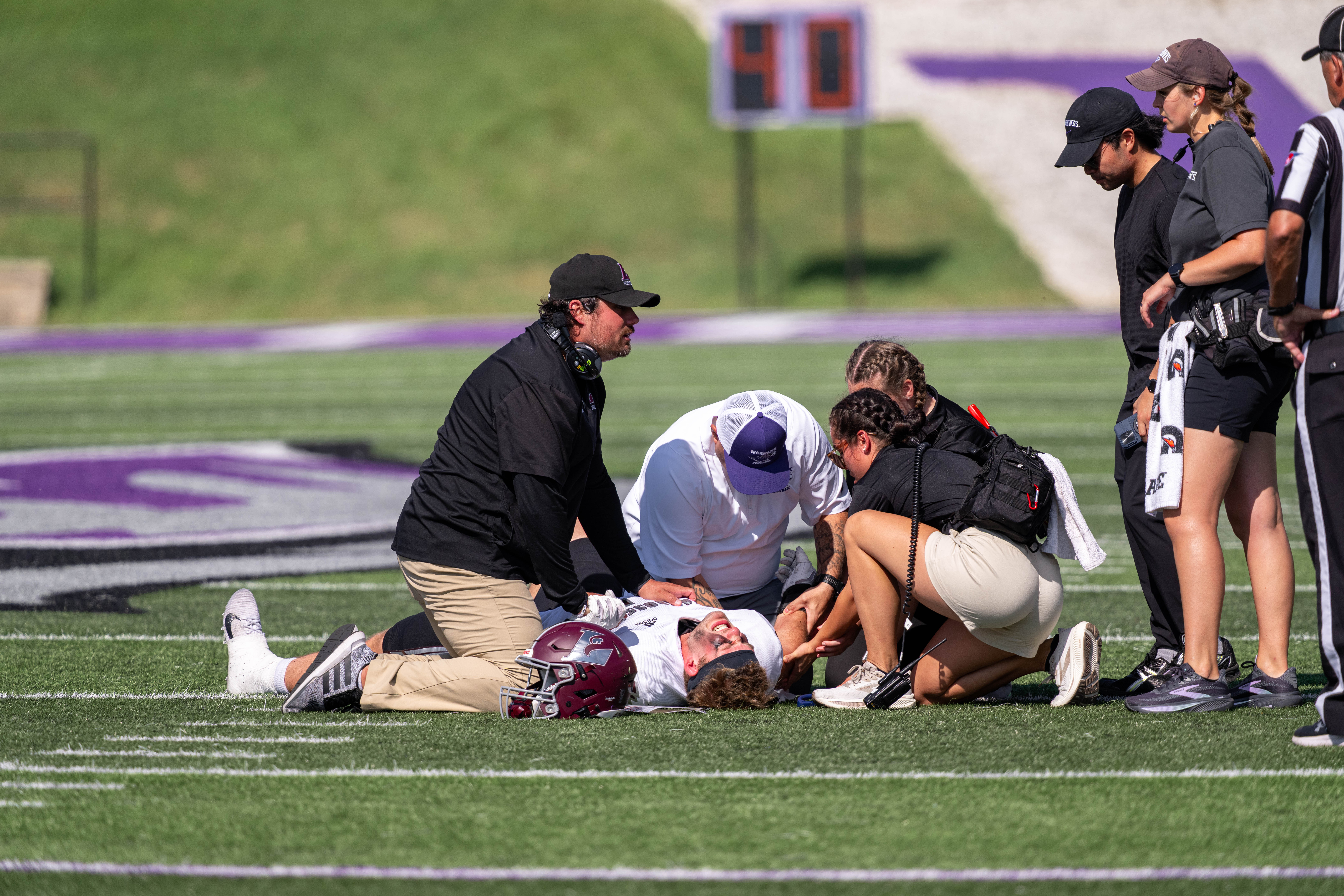 Oct 4, 2025; Whitewater, Wisconsin, USA; University of Wisconsin-La Crosse Eagles defensive lineman Isaac Dagit (42) gets attention after suffering an apparent arm injury durning a college football game between the University of Wisconsin-Whitewater Warhawks and the University of Wisconsin-La Crosse Eagles at Perkins Stadium on October 04, 2025 in Whitewater, Wisconsin. Photography by Ross Harried for Second Crop Sports.