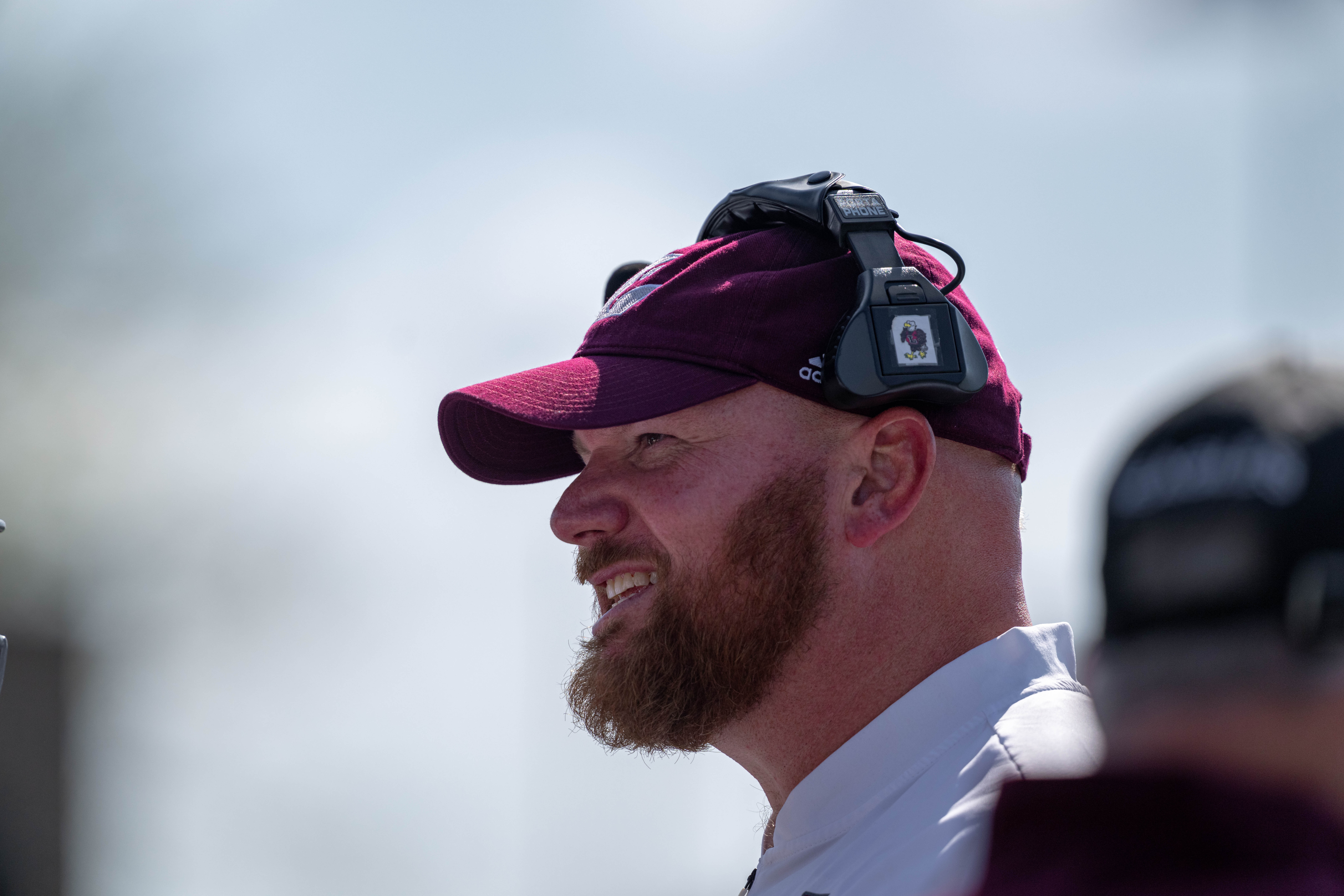 Oct 4, 2025; Whitewater, Wisconsin, USA; Offensive win coach Andrew McGlenn durning a college football game between the University of Wisconsin-Whitewater Warhawks and the University of Wisconsin-La Crosse Eagles at Perkins Stadium on October 04, 2025 in Whitewater, Wisconsin. Photography by Ross Harried for Second Crop Sports.