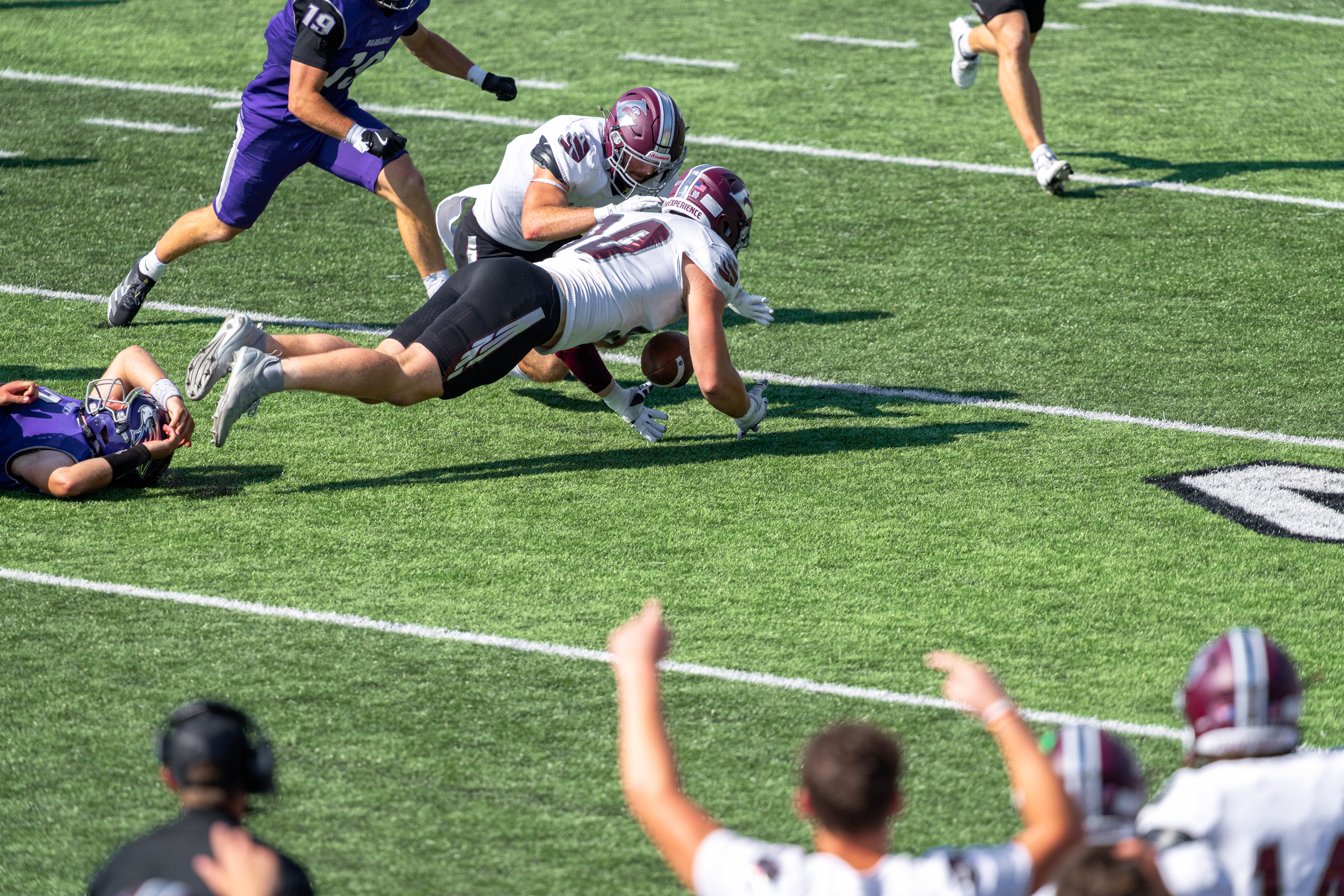 Oct 4, 2025; Whitewater, Wisconsin, USA; University of Wisconsin-La Crosse Eagles defensive lineman Thomas Laufenberg (90) recovers a fumble durning a college football game between the University of Wisconsin-Whitewater Warhawks and the University of Wisconsin-La Crosse Eagles at Perkins Stadium on October 04, 2025 in Whitewater, Wisconsin. Photography by Ross Harried for Second Crop Sports.