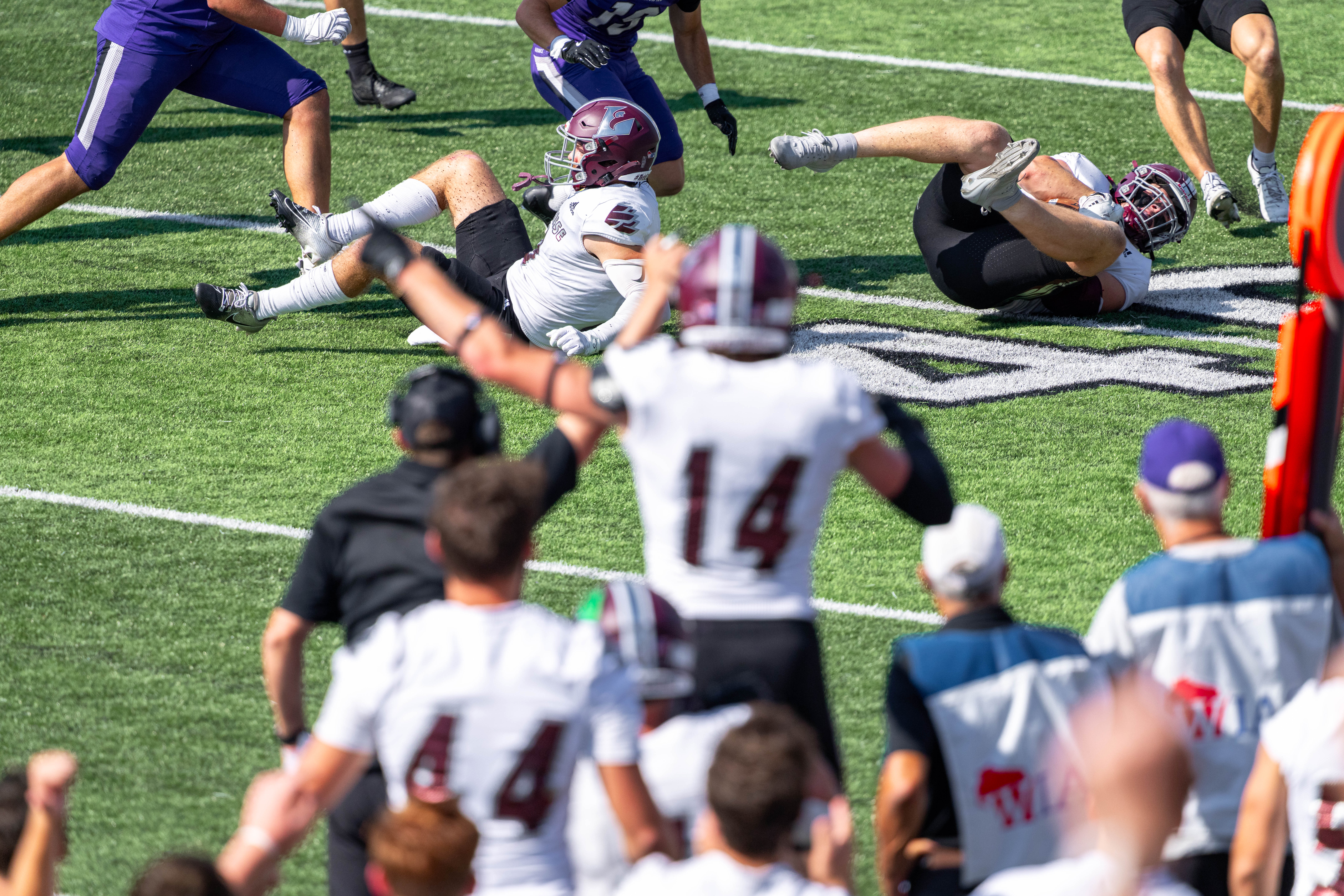 Oct 4, 2025; Whitewater, Wisconsin, USA; University of Wisconsin-La Crosse Eagles defensive lineman Thomas Laufenberg (90) recovers a fumble durning a college football game between the University of Wisconsin-Whitewater Warhawks and the University of Wisconsin-La Crosse Eagles at Perkins Stadium on October 04, 2025 in Whitewater, Wisconsin. Photography by Ross Harried for Second Crop Sports.