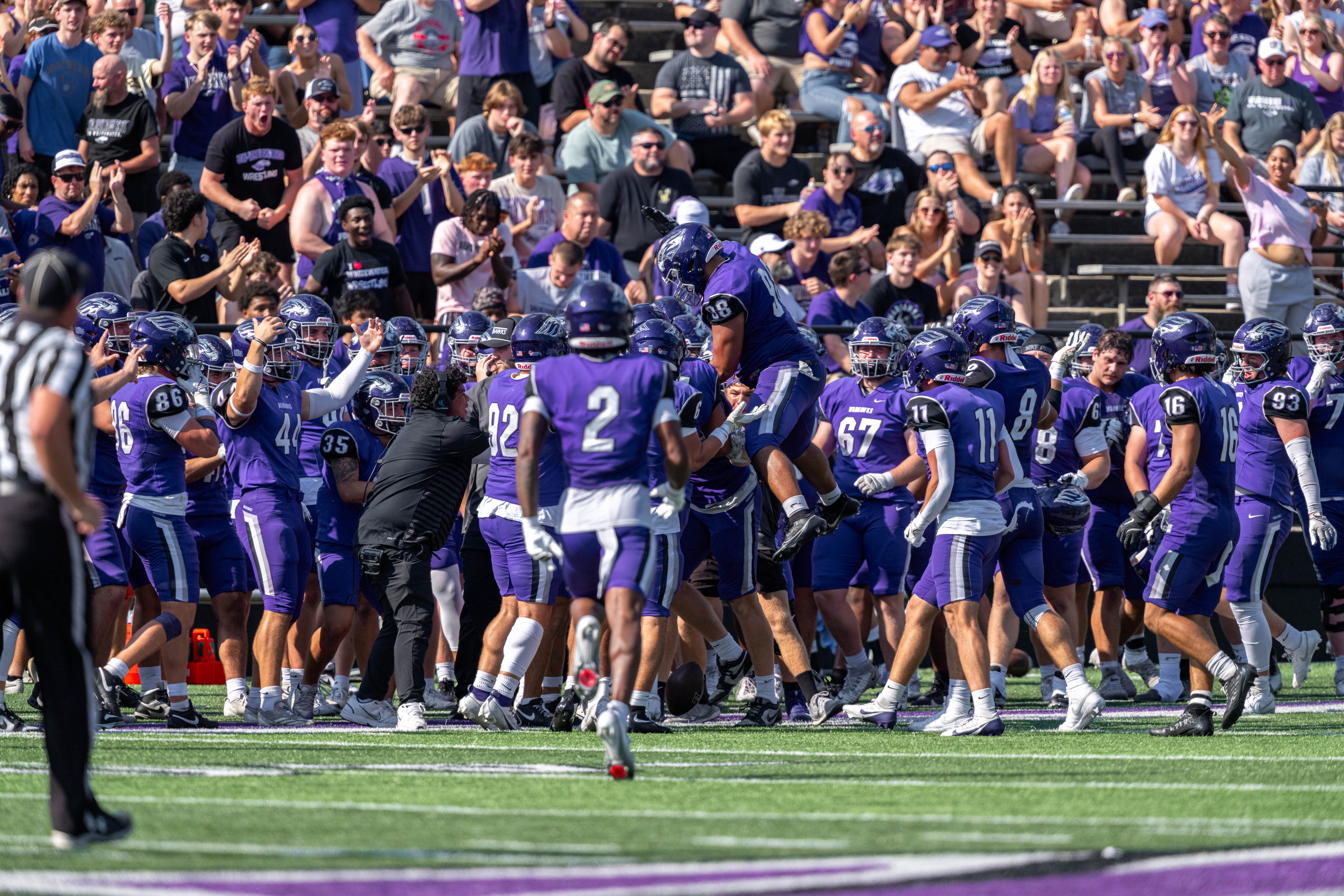 Oct 4, 2025; Whitewater, Wisconsin, USA; The University of Wisconsin-Whitewater Warhawks bench celebrates after a play durning a college football game between the University of Wisconsin-Whitewater Warhawks and the University of Wisconsin-La Crosse Eagles at Perkins Stadium on October 04, 2025 in Whitewater, Wisconsin. Photography by Ross Harried for Second Crop Sports.