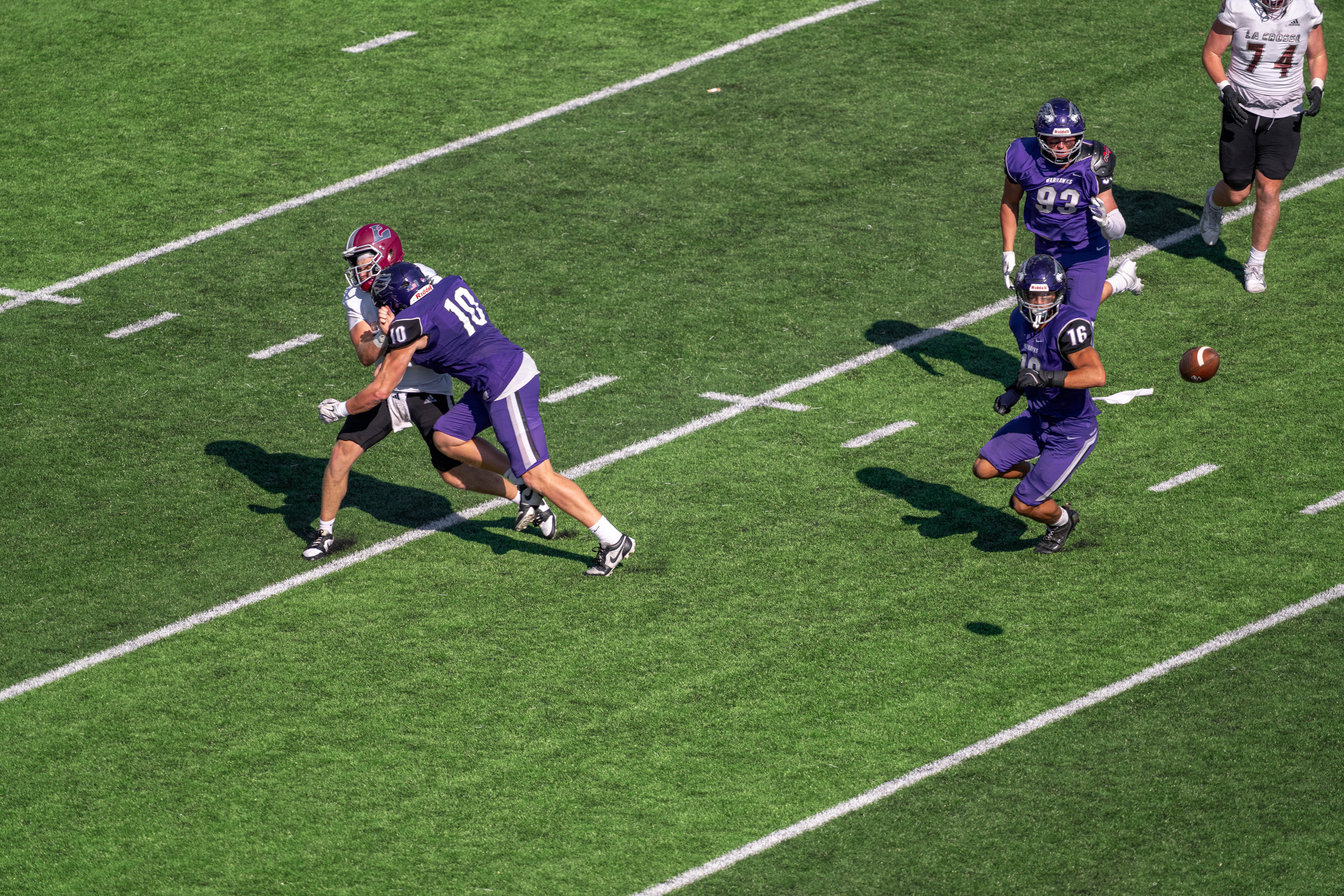 Oct 4, 2025; Whitewater, Wisconsin, USA; University of Wisconsin-Whitewater Warhawks linebacker Ethan Gallagher (10) hits University of Wisconsin-La Crosse Eagles quarterback Kyle Haas (2) durning a college football game between the University of Wisconsin-Whitewater Warhawks and the University of Wisconsin-La Crosse Eagles at Perkins Stadium on October 04, 2025 in Whitewater, Wisconsin. Photography by Ross Harried for Second Crop Sports.