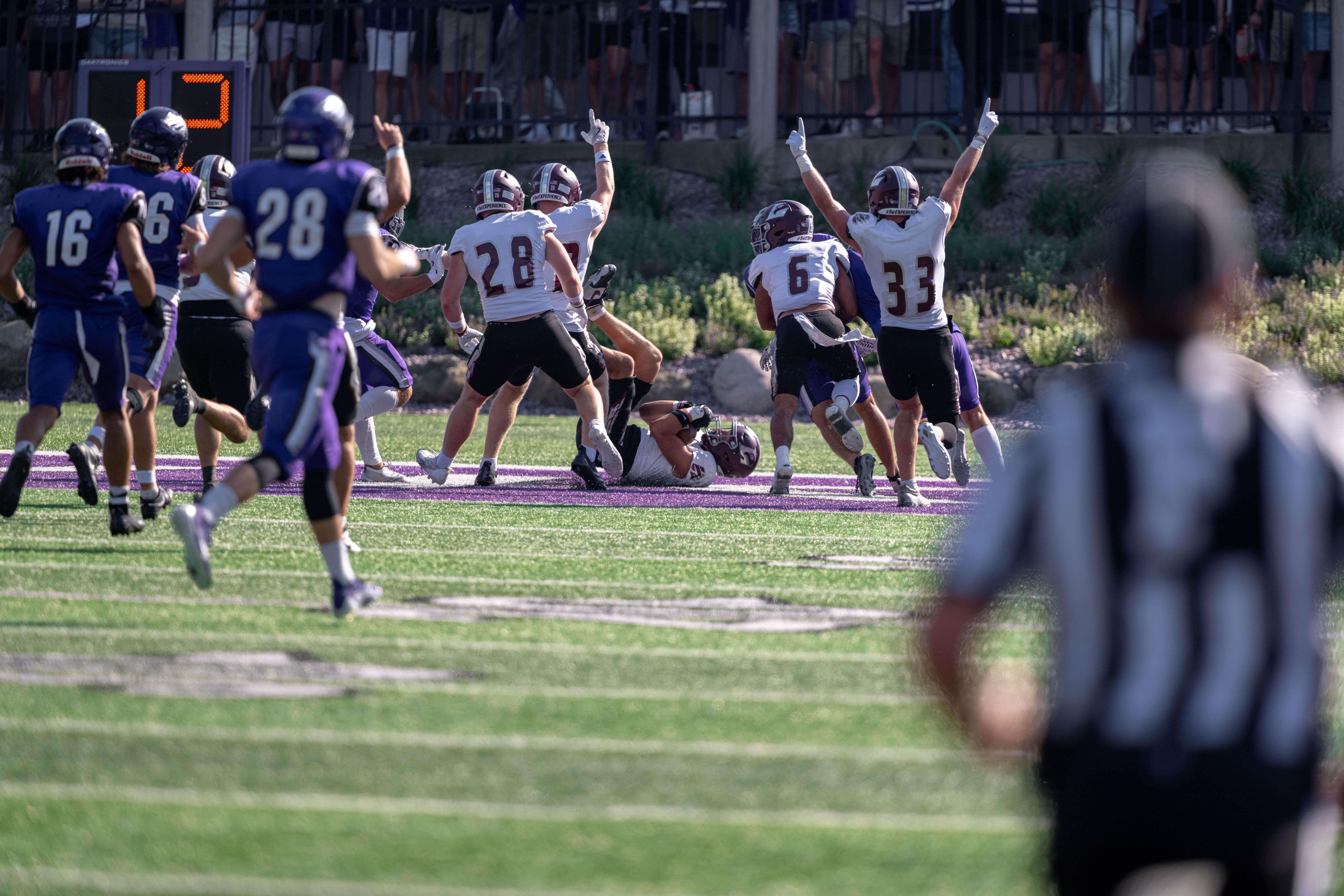 Oct 4, 2025; Whitewater, Wisconsin, USA; The University of Wisconsin-La Crosse Eagles celebrates a touchdown after recovering a fumble in the end zone durning a college football game between the University of Wisconsin-Whitewater Warhawks and the University of Wisconsin-La Crosse Eagles at Perkins Stadium on October 04, 2025 in Whitewater, Wisconsin. Photography by Ross Harried for Second Crop Sports.