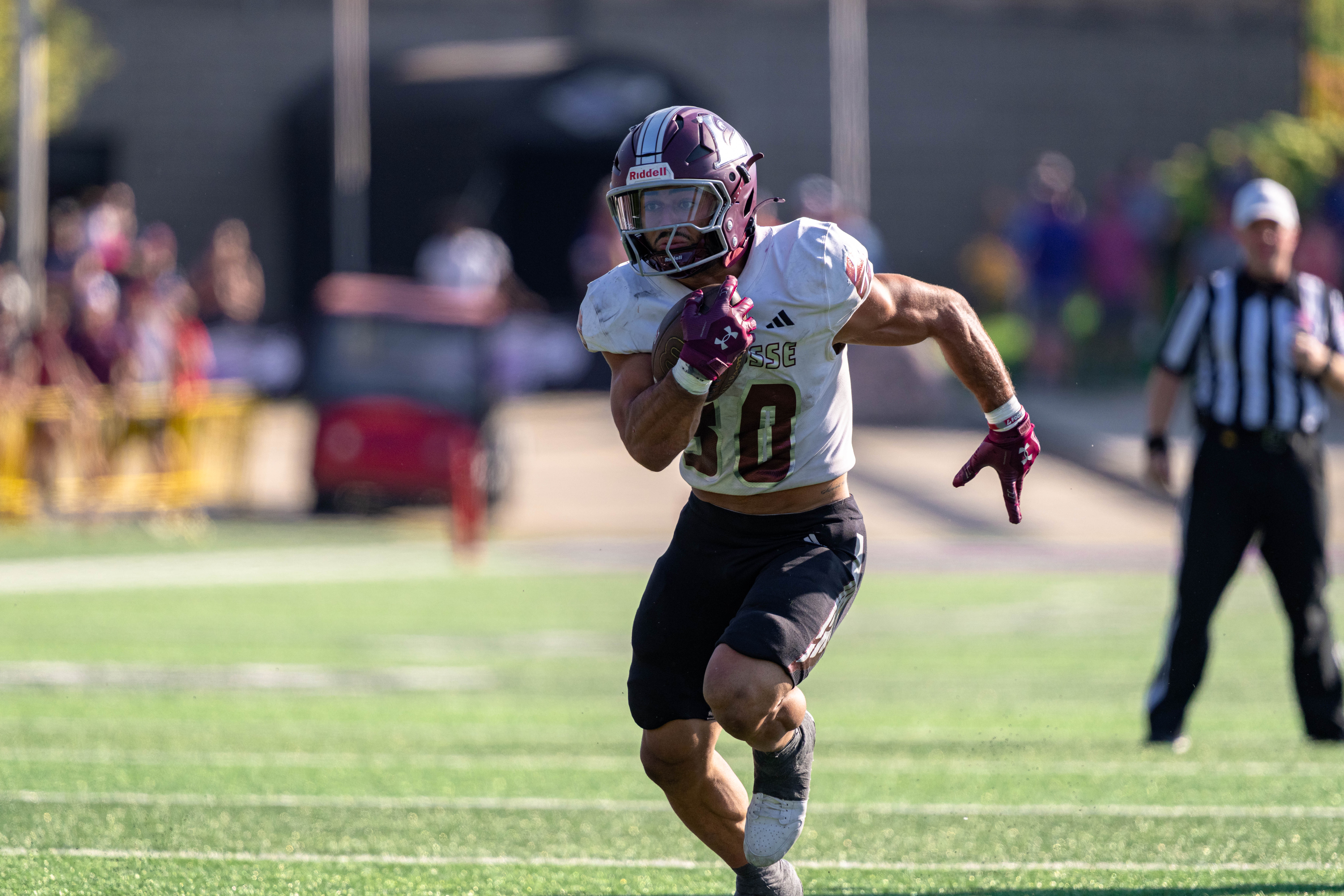 Oct 4, 2025; Whitewater, Wisconsin, USA; University of Wisconsin-La Crosse Eagles running back Gabe Lynch (30) runs the ball durning a college football game between the University of Wisconsin-Whitewater Warhawks and the University of Wisconsin-La Crosse Eagles at Perkins Stadium on October 04, 2025 in Whitewater, Wisconsin. Photography by Ross Harried for Second Crop Sports.