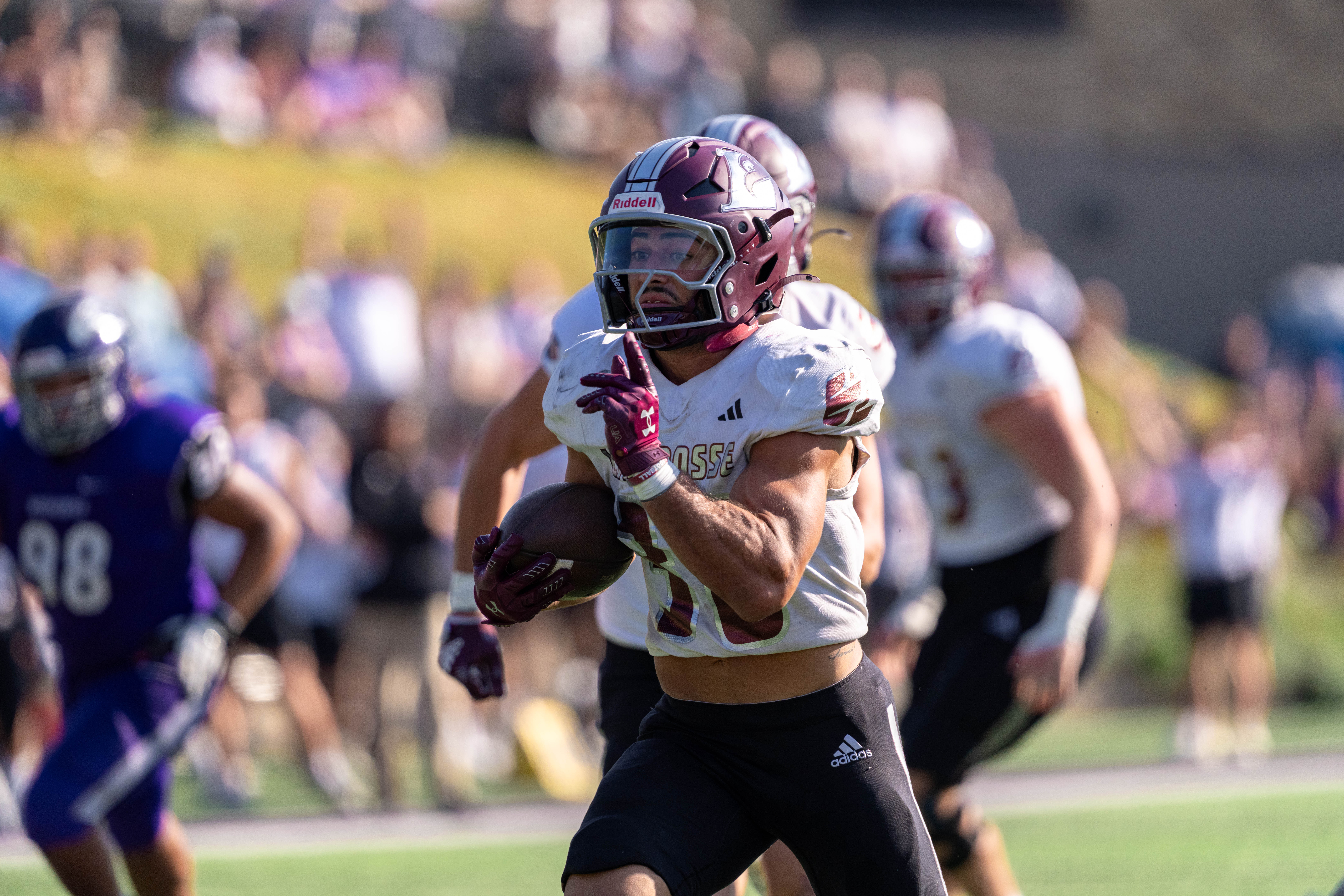 Oct 4, 2025; Whitewater, Wisconsin, USA; University of Wisconsin-La Crosse Eagles running back Gabe Lynch (30) runs the ball durning a college football game between the University of Wisconsin-Whitewater Warhawks and the University of Wisconsin-La Crosse Eagles at Perkins Stadium on October 04, 2025 in Whitewater, Wisconsin. Photography by Ross Harried for Second Crop Sports.