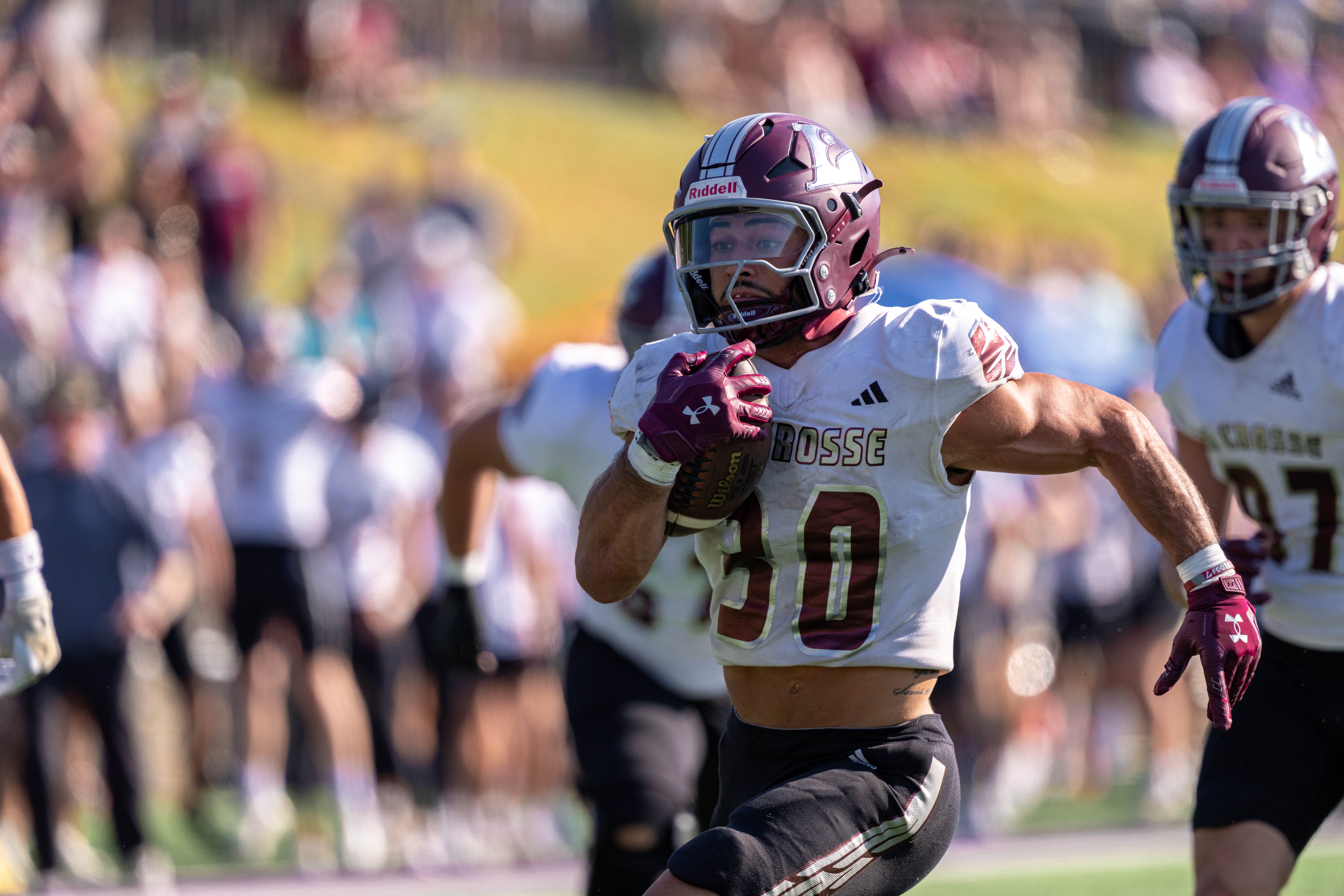 Oct 4, 2025; Whitewater, Wisconsin, USA; University of Wisconsin-La Crosse Eagles running back Gabe Lynch (30) runs the ball durning a college football game between the University of Wisconsin-Whitewater Warhawks and the University of Wisconsin-La Crosse Eagles at Perkins Stadium on October 04, 2025 in Whitewater, Wisconsin. Photography by Ross Harried for Second Crop Sports.