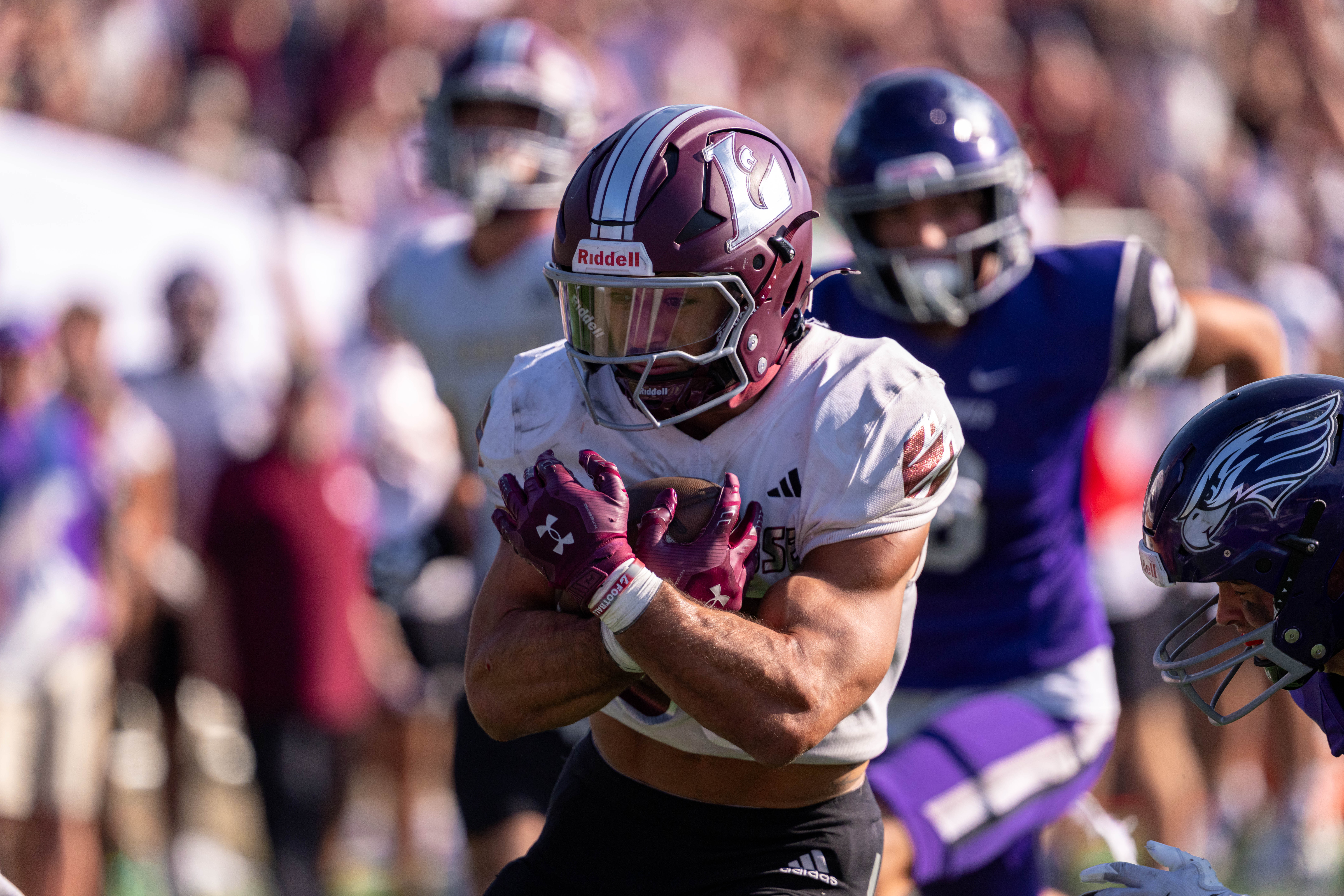 Oct 4, 2025; Whitewater, Wisconsin, USA; University of Wisconsin-La Crosse Eagles running back Gabe Lynch (30) runs the ball durning a college football game between the University of Wisconsin-Whitewater Warhawks and the University of Wisconsin-La Crosse Eagles at Perkins Stadium on October 04, 2025 in Whitewater, Wisconsin. Photography by Ross Harried for Second Crop Sports.