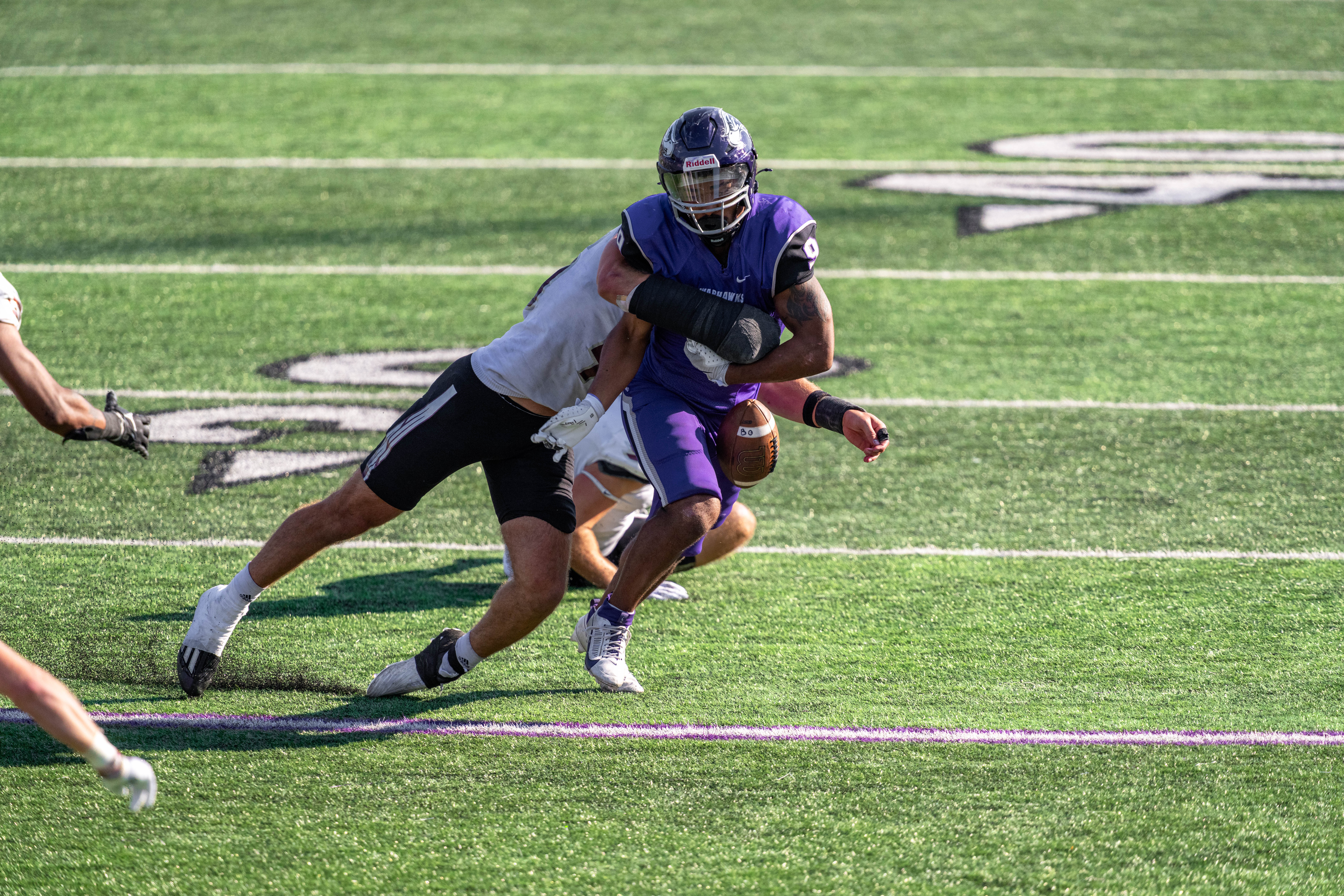 Oct 4, 2025; Whitewater, Wisconsin, USA; University of Wisconsin-La Crosse Eagles linebacker Aaron Winters (45) forces a fumble from University of Wisconsin-Whitewater Warhawks running back Brian Stanton (9) durning a college football game between the University of Wisconsin-Whitewater Warhawks and the University of Wisconsin-La Crosse Eagles at Perkins Stadium on October 04, 2025 in Whitewater, Wisconsin. Photography by Ross Harried for Second Crop Sports.