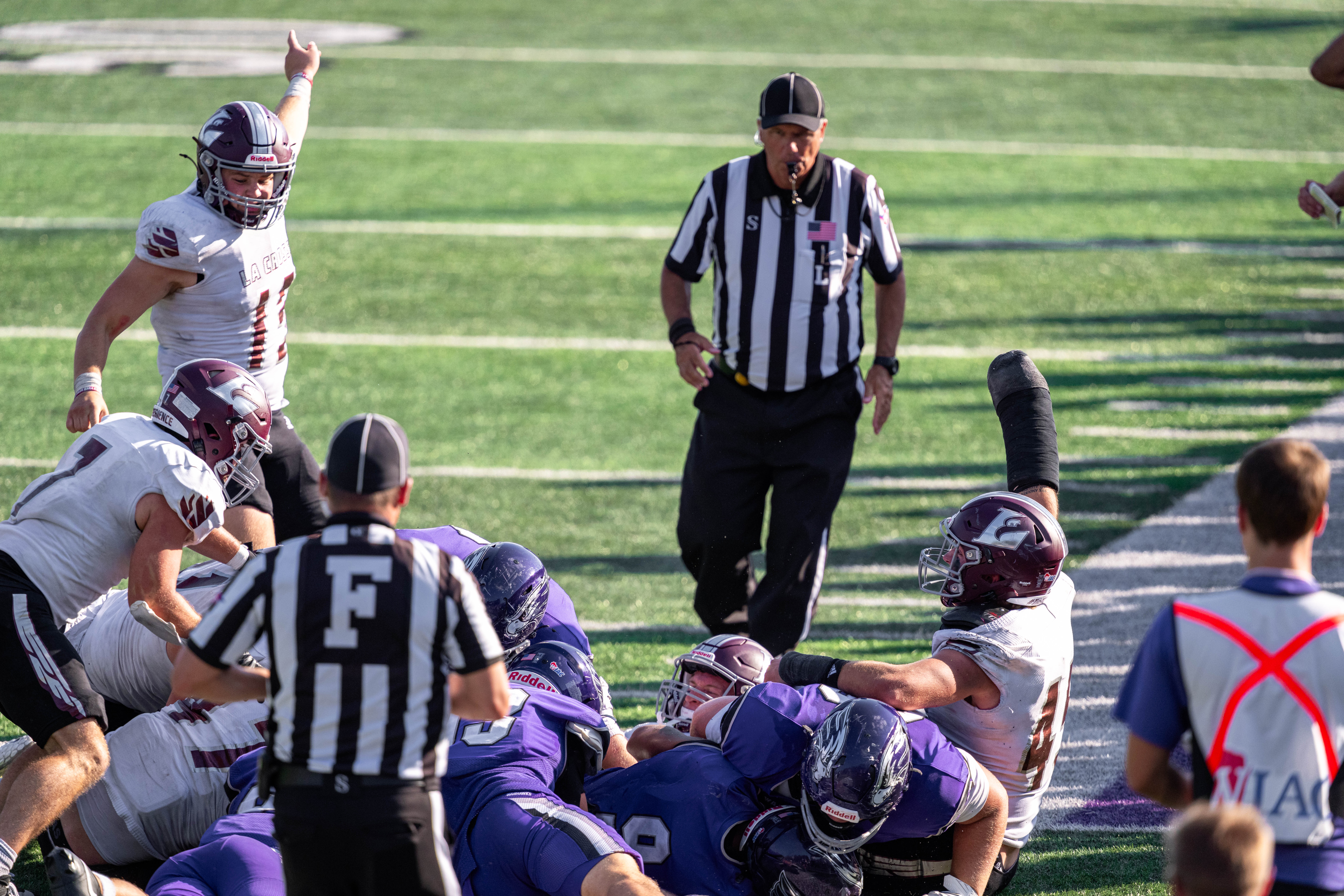 Oct 4, 2025; Whitewater, Wisconsin, USA; A fight for a fumbled ball in overtime unfolds durning a college football game between the University of Wisconsin-Whitewater Warhawks and the University of Wisconsin-La Crosse Eagles at Perkins Stadium on October 04, 2025 in Whitewater, Wisconsin. Photography by Ross Harried for Second Crop Sports.